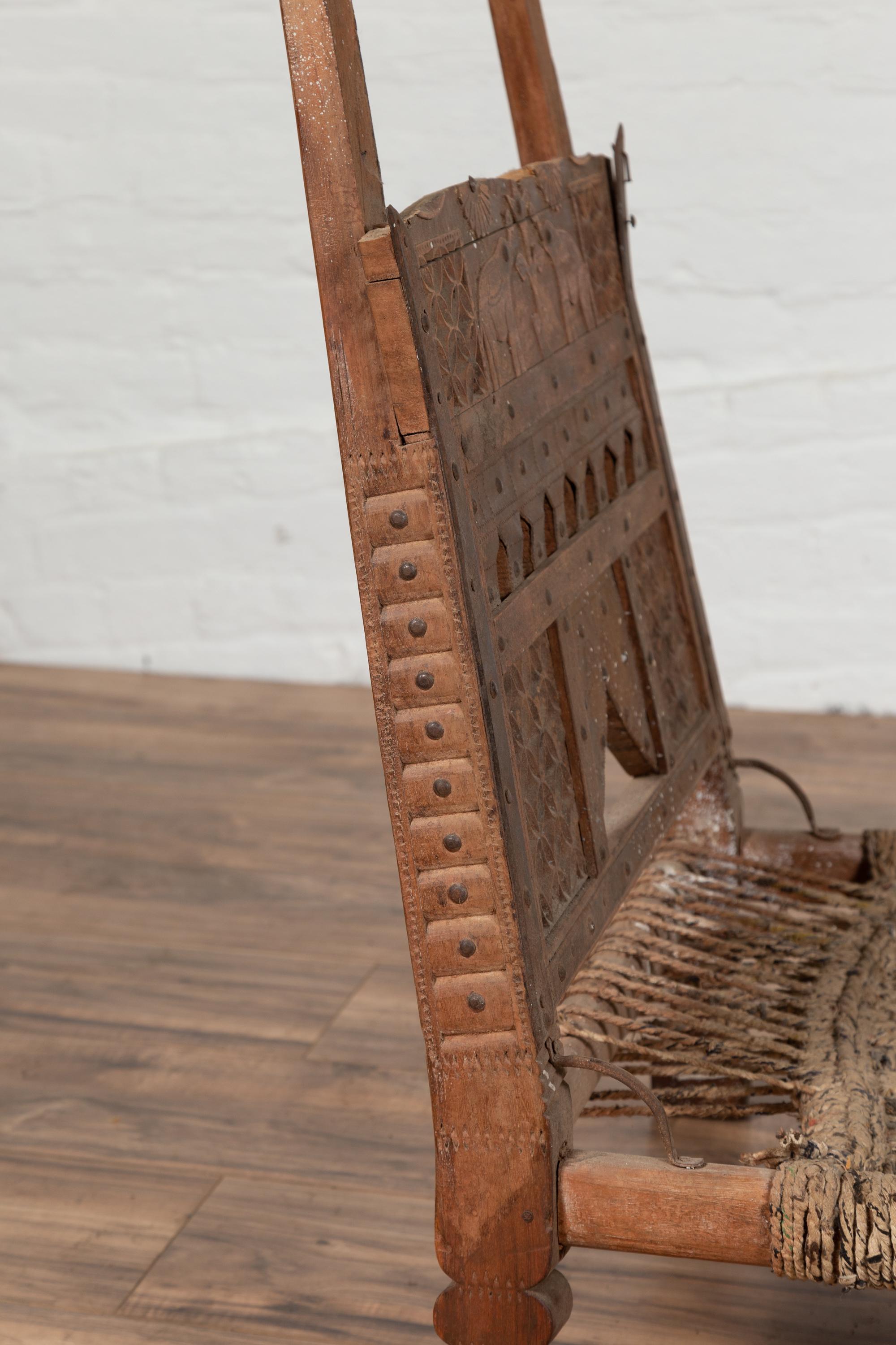 Rustic Indian Low Wooden Chair with Rope Seat and Weathered Appearance For Sale 3