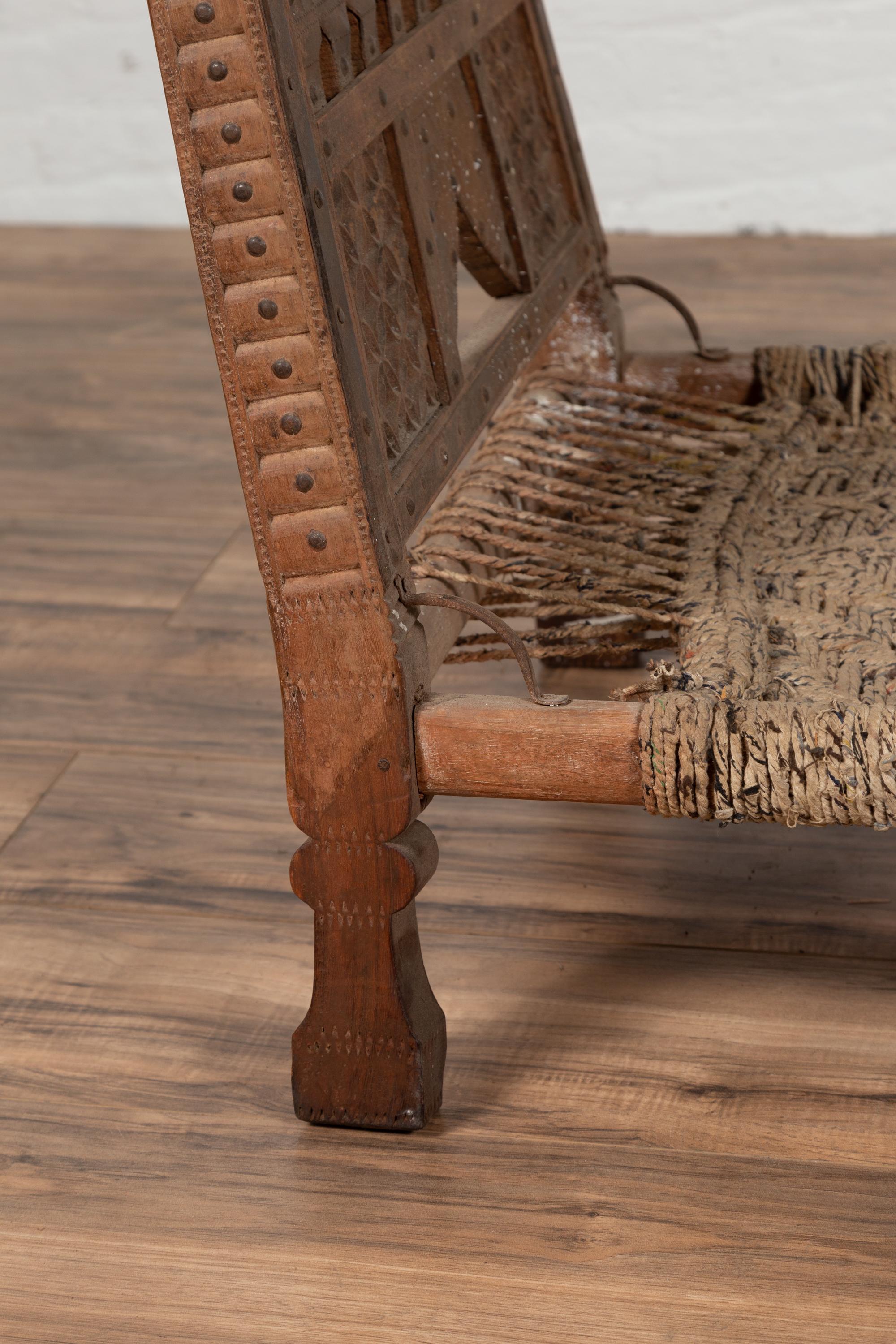Rustic Indian Low Wooden Chair with Rope Seat and Weathered Appearance For Sale 5