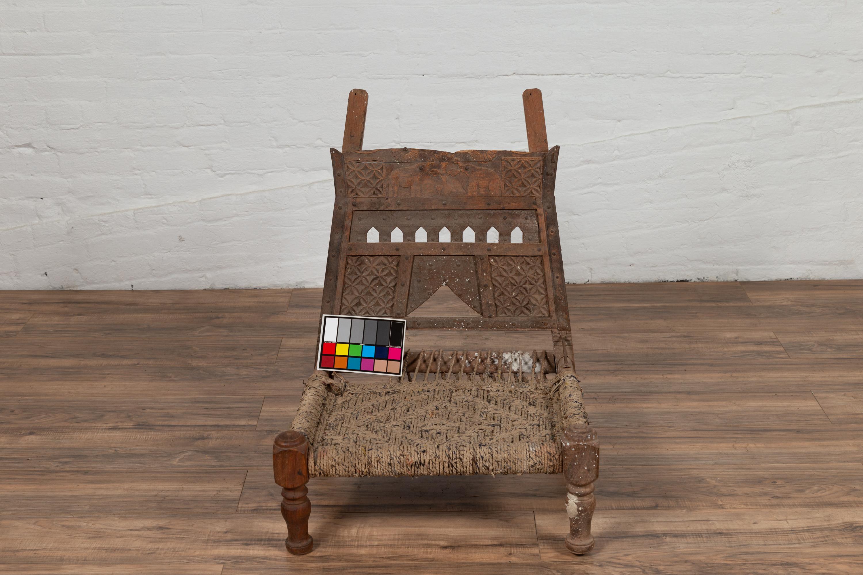 Rustic Indian Low Wooden Chair with Rope Seat and Weathered Appearance For Sale 8