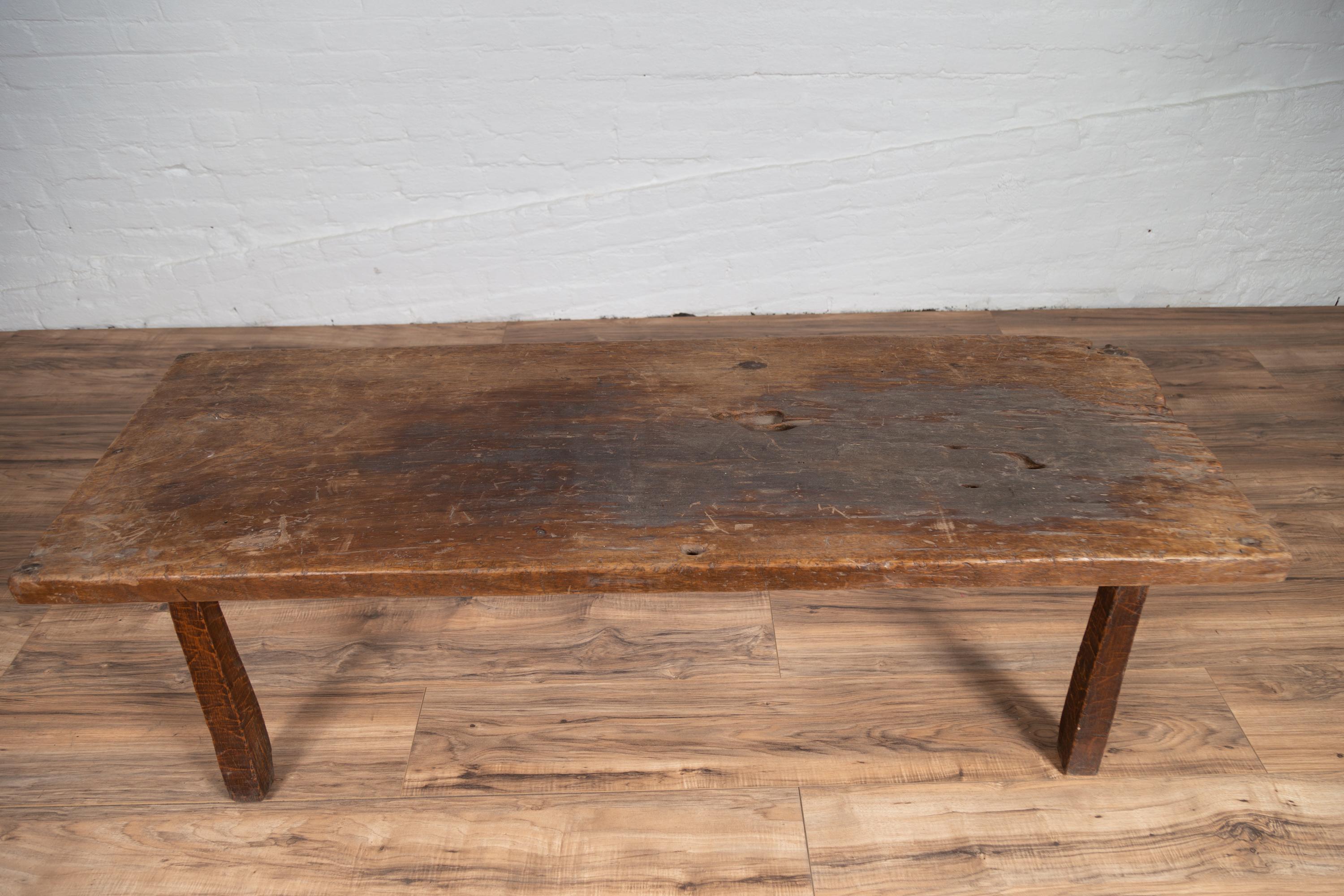 20th Century Rustic Indonesian Antique Wooden Bench with Weathered Appearance
