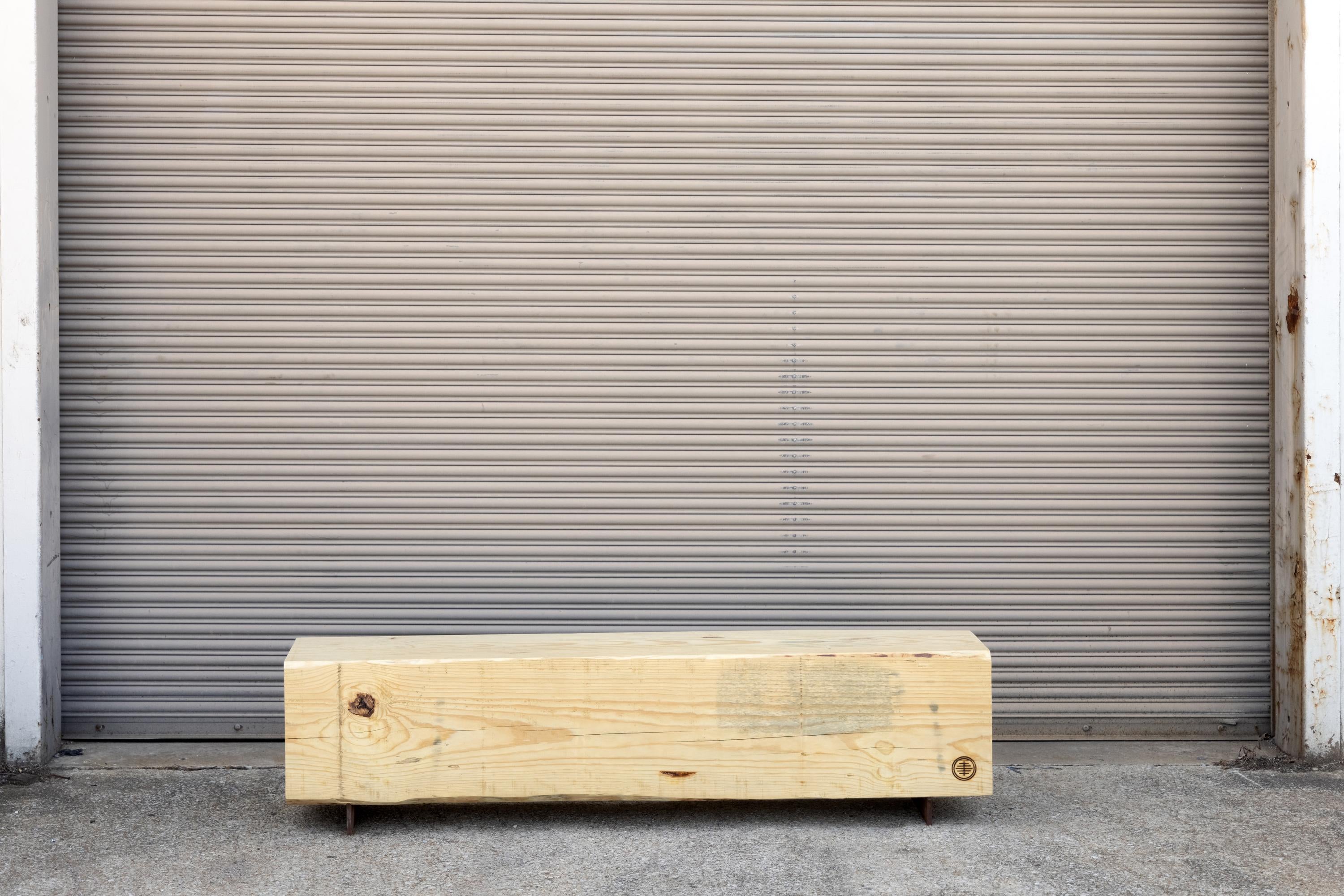 Our beam bench utilizes salvaged local pine logs for a rustic bench for indoors or outdoors. Narrow and backless, the simple lines express the natural texture of the end grain of each species. The 15