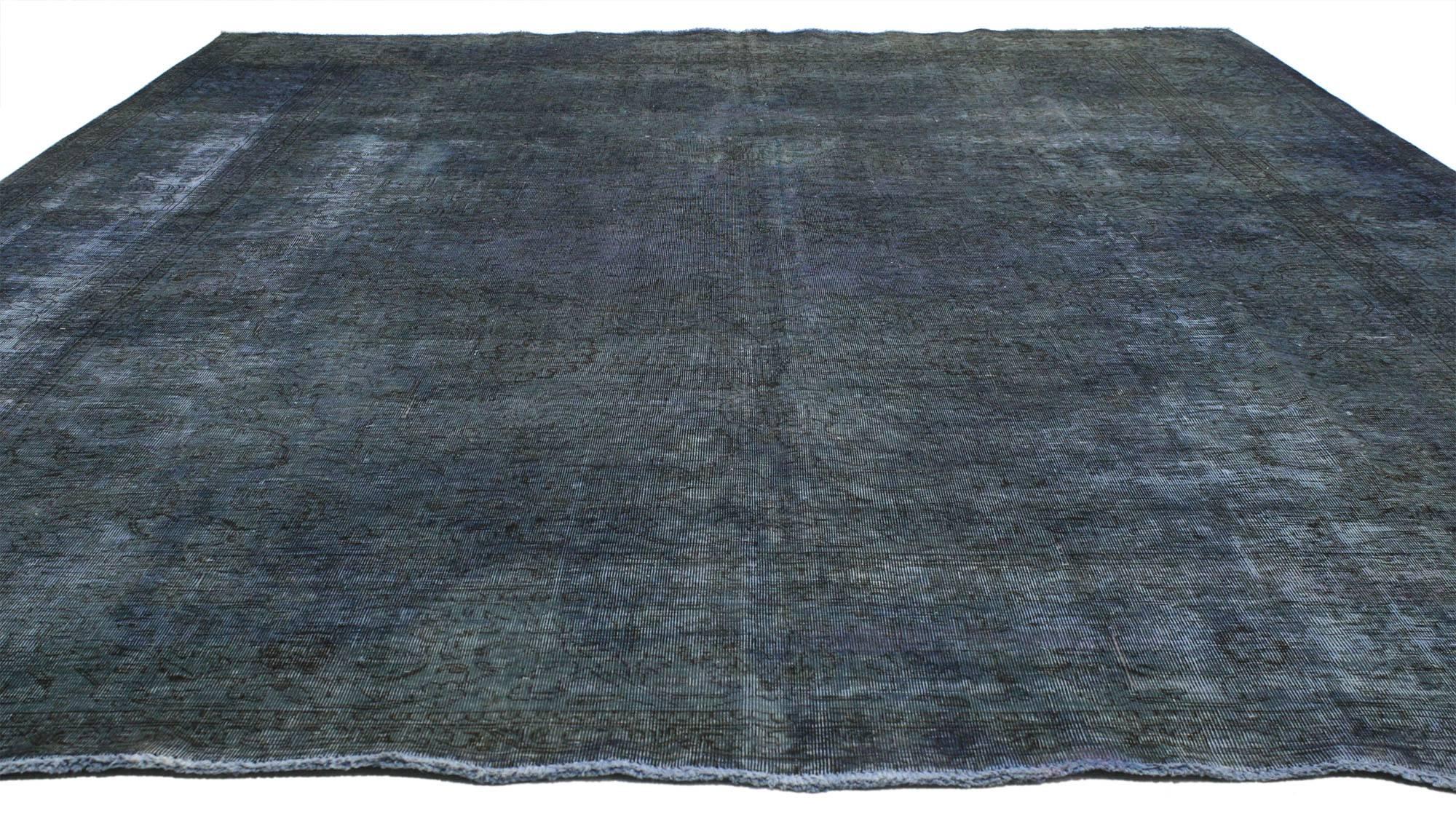 80395, Rustic Industrial Distressed Vintage Overdyed Persian Area Rug. This blue-grey colored rug combines the Classic elegance of traditional Persian rug motifs such as ornate floral and scroll work designs with a contemporary overdyed finish. The
