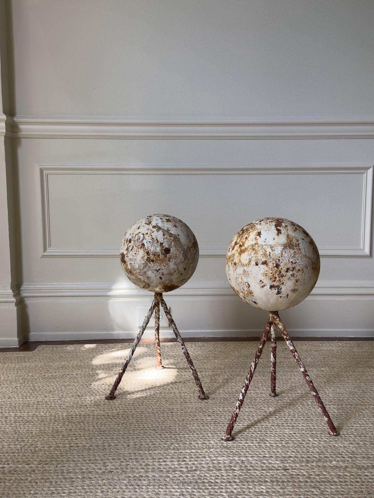 Iron orb sculptures with integrated rebar legs for indoor or out with wonderful texture and rusted patina. Sold individually.

These orbs make a wonderful statement in the garden or in an interior. 

Shown with art and objects from Lars Ly: The