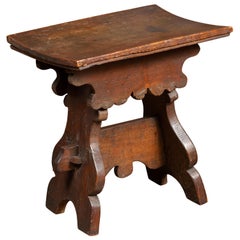 Rustic Italian 1800s Walnut Stool with Splaying Trestle Base and Carved Apron