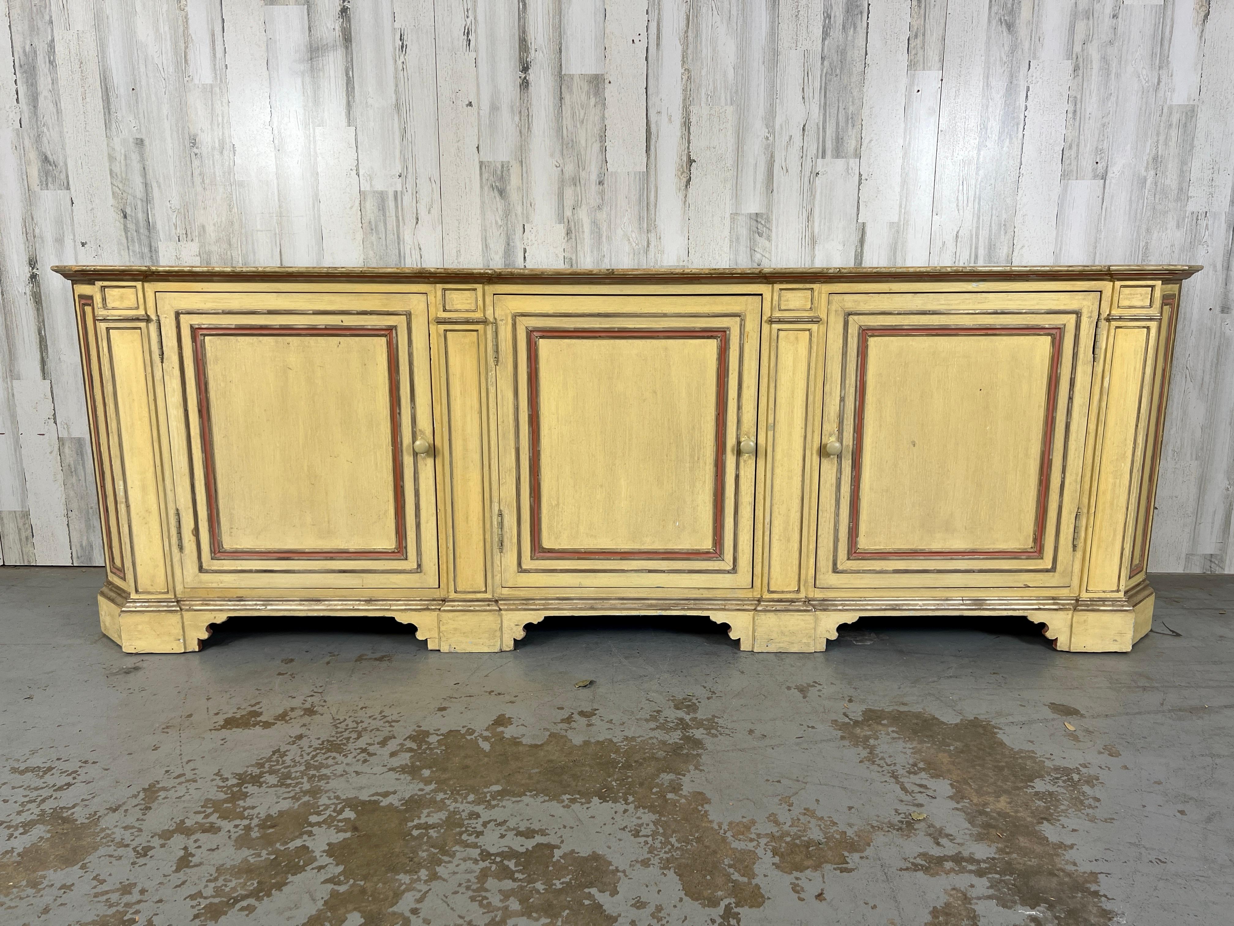 Rustic Italian Hand Painted Sideboard With Faux Marble Top. Very common in the countryside of Italy to paint furniture to have the appearance of being a more expensive. Three doors that reveal a painted interior with a shelf that extends the length