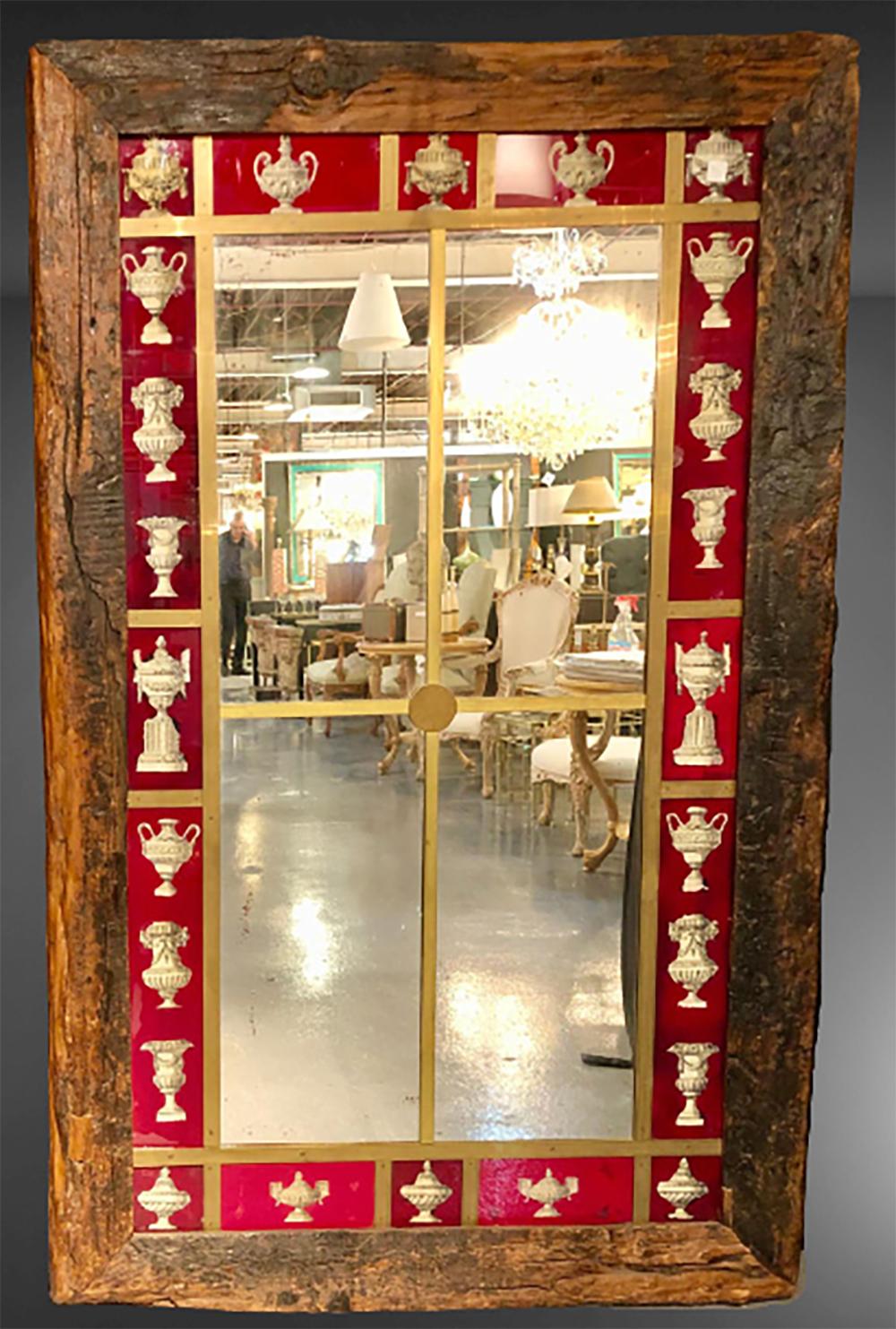 Rustic Italian wall mirror. Large wall mirror. Timber frame with reverse painted and mirrored glass. Brass trim.


1HH.