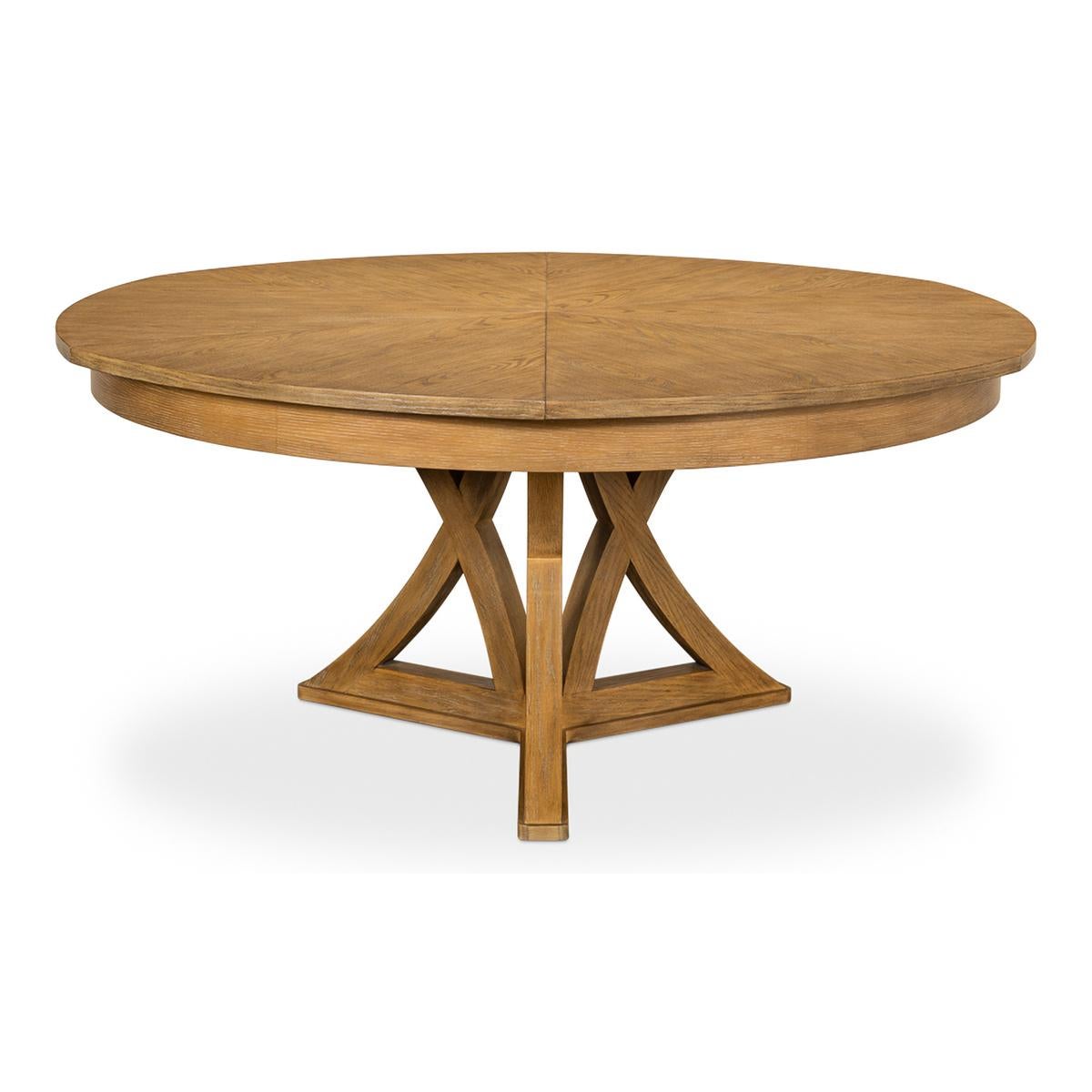 A Transitional Rustic oak round extending dining table. The oak table in our warm finish is a great combination of classic style and modern amenities. Closed it is 64