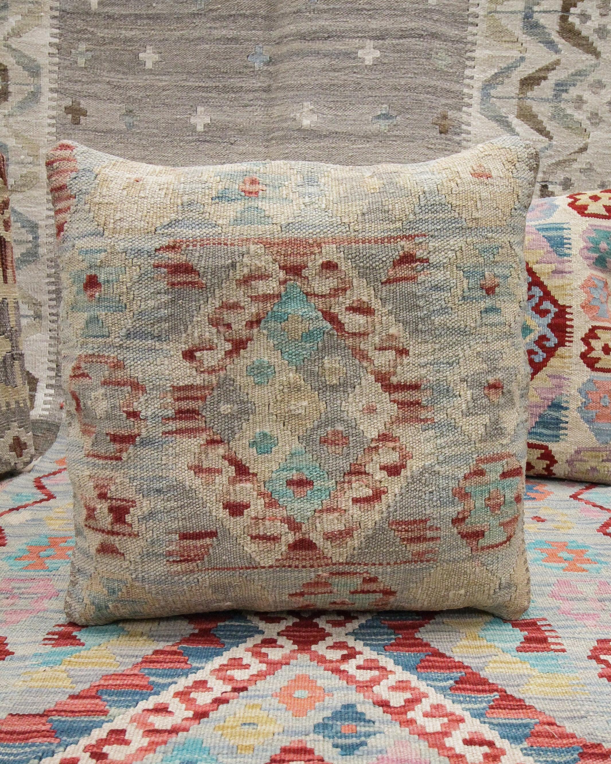 This new traditional kilim cushion cover is a handwoven piece constructed in the early 21st century. The design has been delicately woven by hand and features a symmetrical geometric pattern that is sure to stand out on any sofa or armchair! This