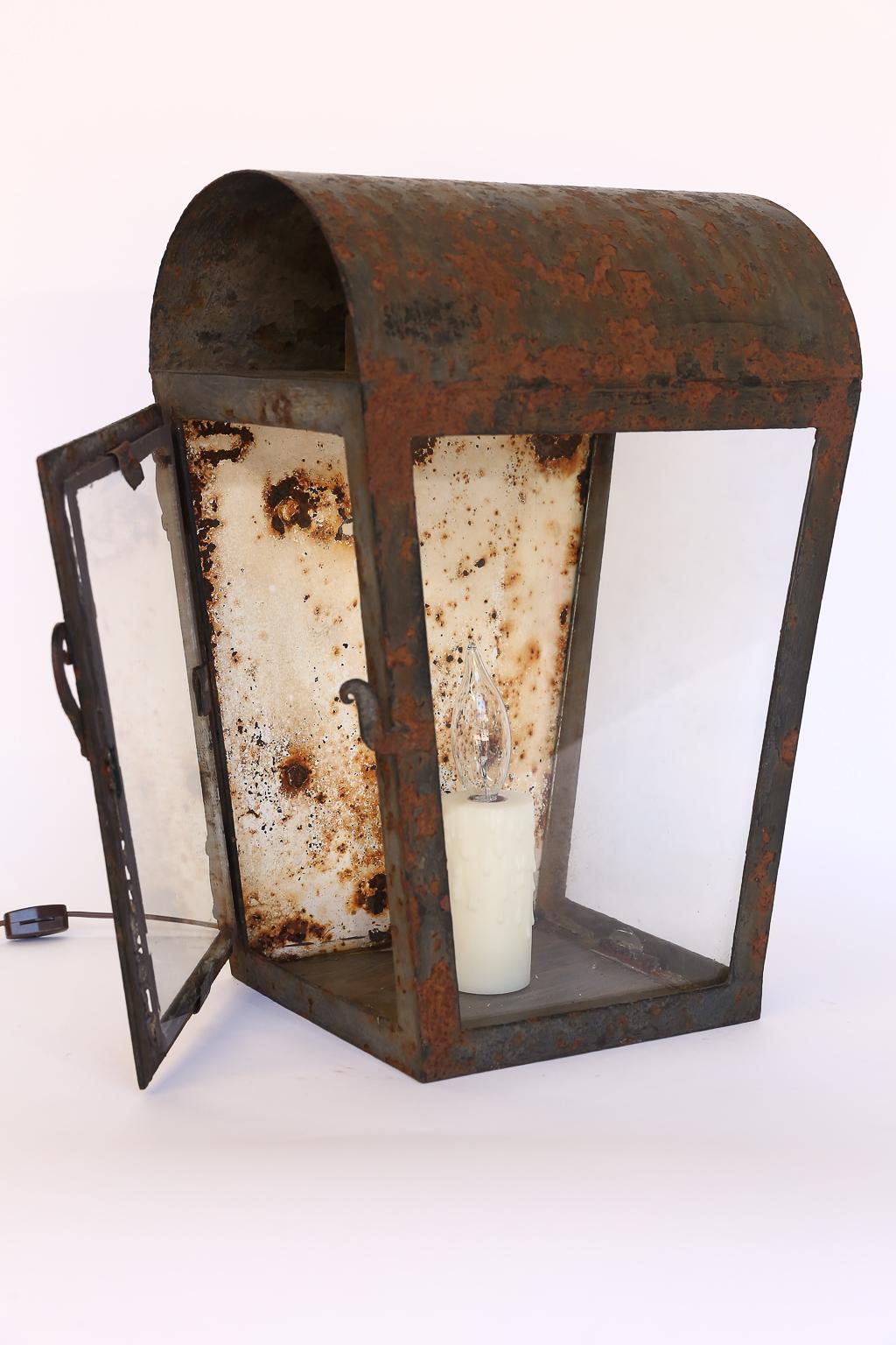 Rustic lantern table lamp. We gave this charming old lantern a new life by making it into a table lamp. It would make a nice statement in any decor.