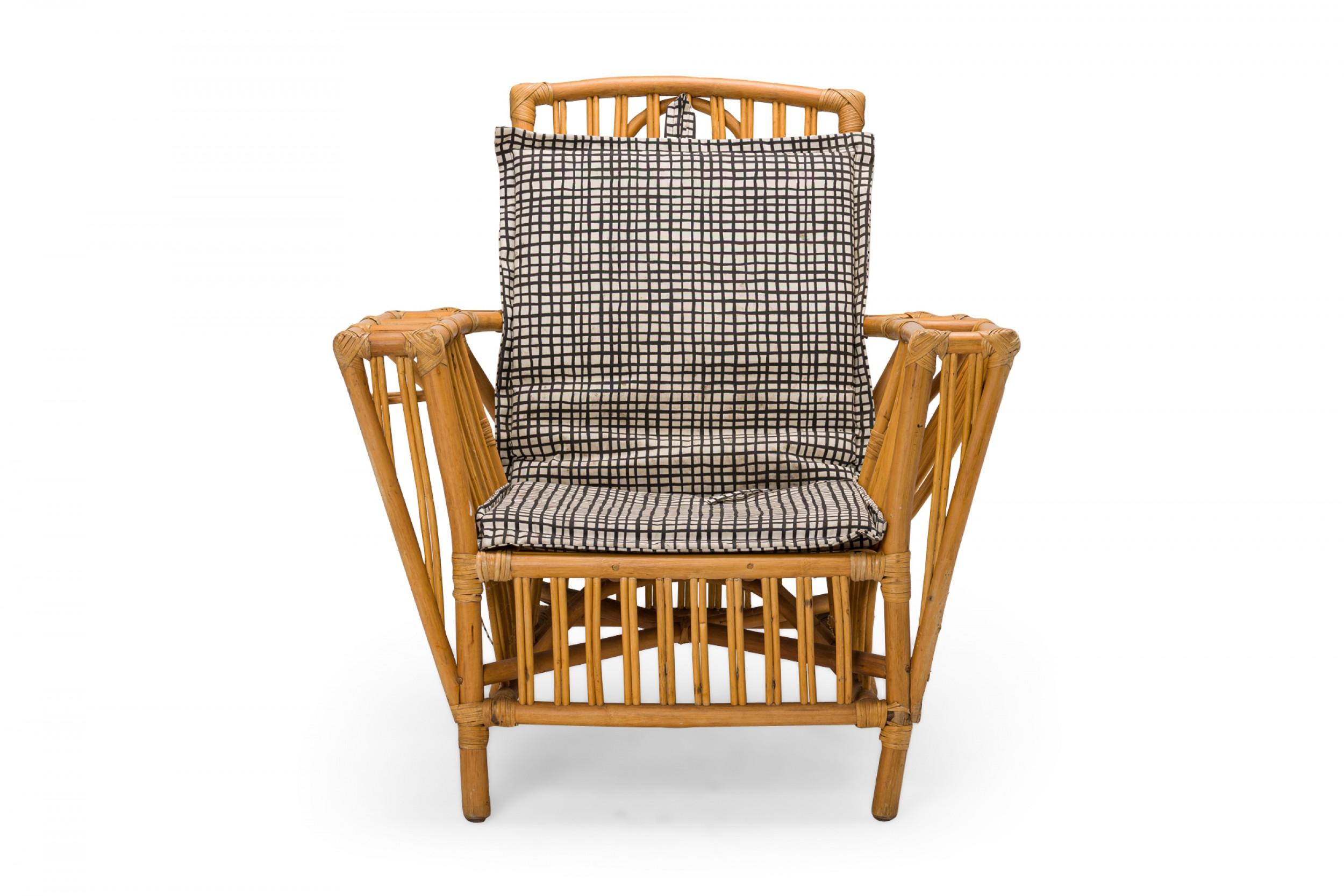 3 mid-centuy light split reed and rattan lounge / armchairs with slightly curved square backs with vertical spindles and arms having built in magazine rack, split reed slat seats, and wicker trim with black and white checkered patterned removable