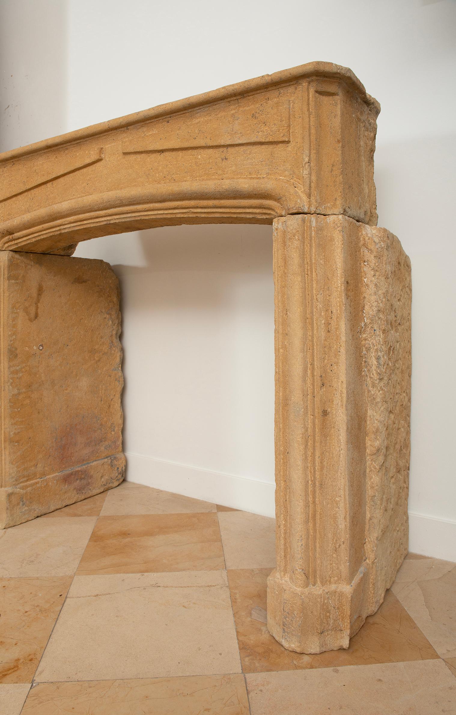 18th Century and Earlier Rustic Limestone Louis XIV Fireplace Mantel For Sale
