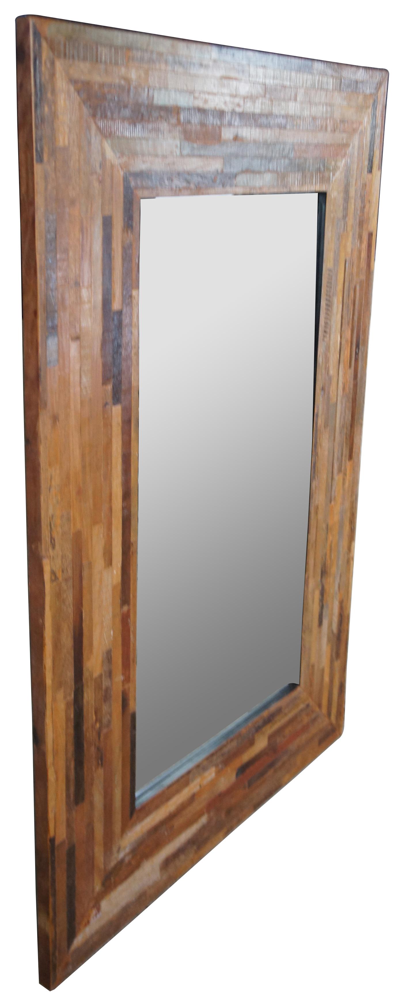 Rectangular driftwood floor or wall mirror. Features multicolor planked wood tones in geometric strips with beveled mirror. Can hang vertical or horizontal.
  