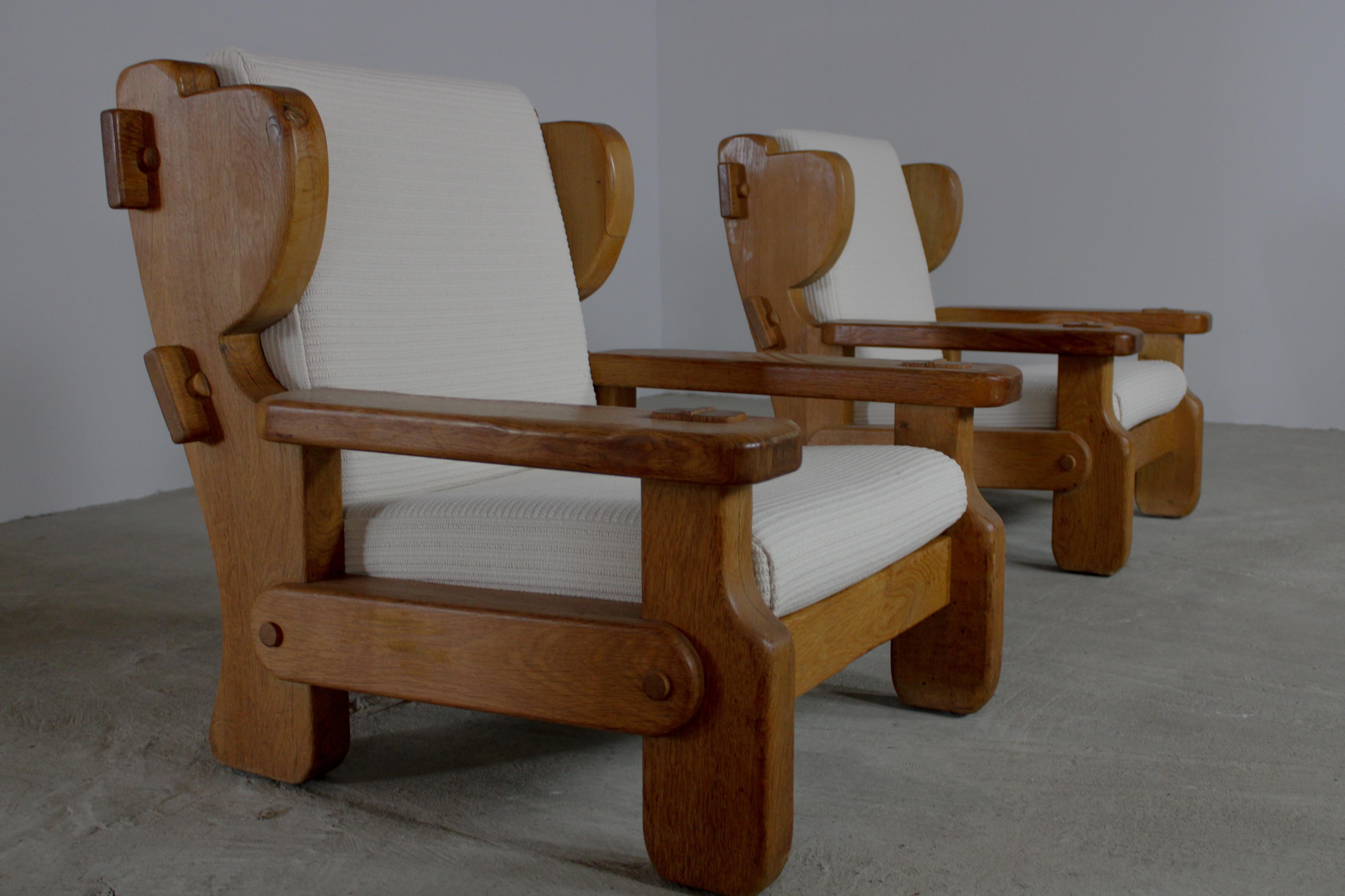 Rustic blond oak lounge chairs are a marriage of timeless elegance and rugged charm, embodying the essence of rustic sophistication. Crafted from sturdy oak wood with a light, blond finish, these chairs exude a natural warmth and inviting allure