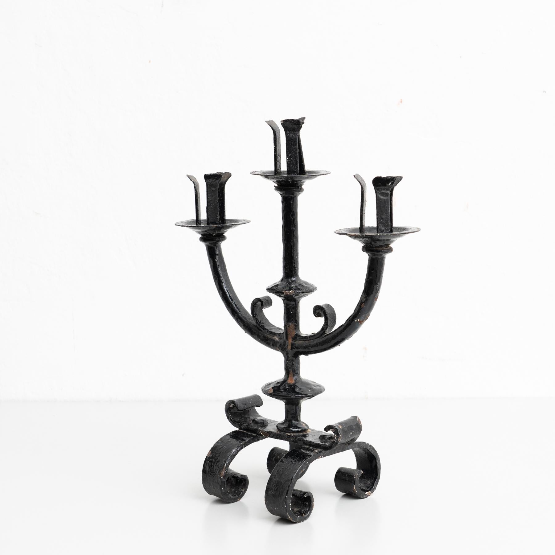 Rustic metal candle holder, circa 1940

Made by unknown manufacturer in Spain.

In original condition, with minor wear consistent with age and use, preserving a beautiful patina.
  
Material:
Metal.

