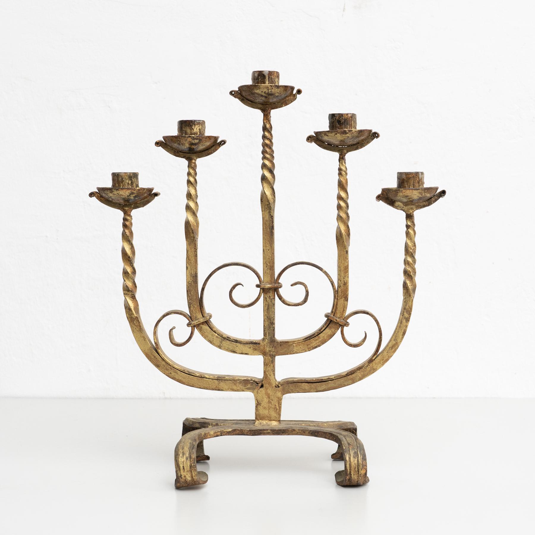 Rustic metal candle holder, circa 1940

Made by unknown manufacturer in Spain.

In original condition, with minor wear consistent with age and use, preserving a beautiful patina.
  
Material:
Metal.

