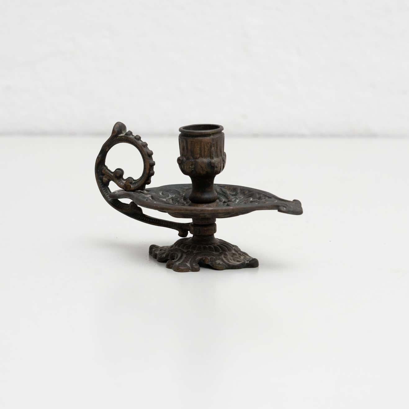 Rustic metal candle holder, circa 1950
By unknown manufacturer. Spain

In original condition, with minor wear consistent with age and use, preserving a beautiful patina.
  
Material:
Metal.

