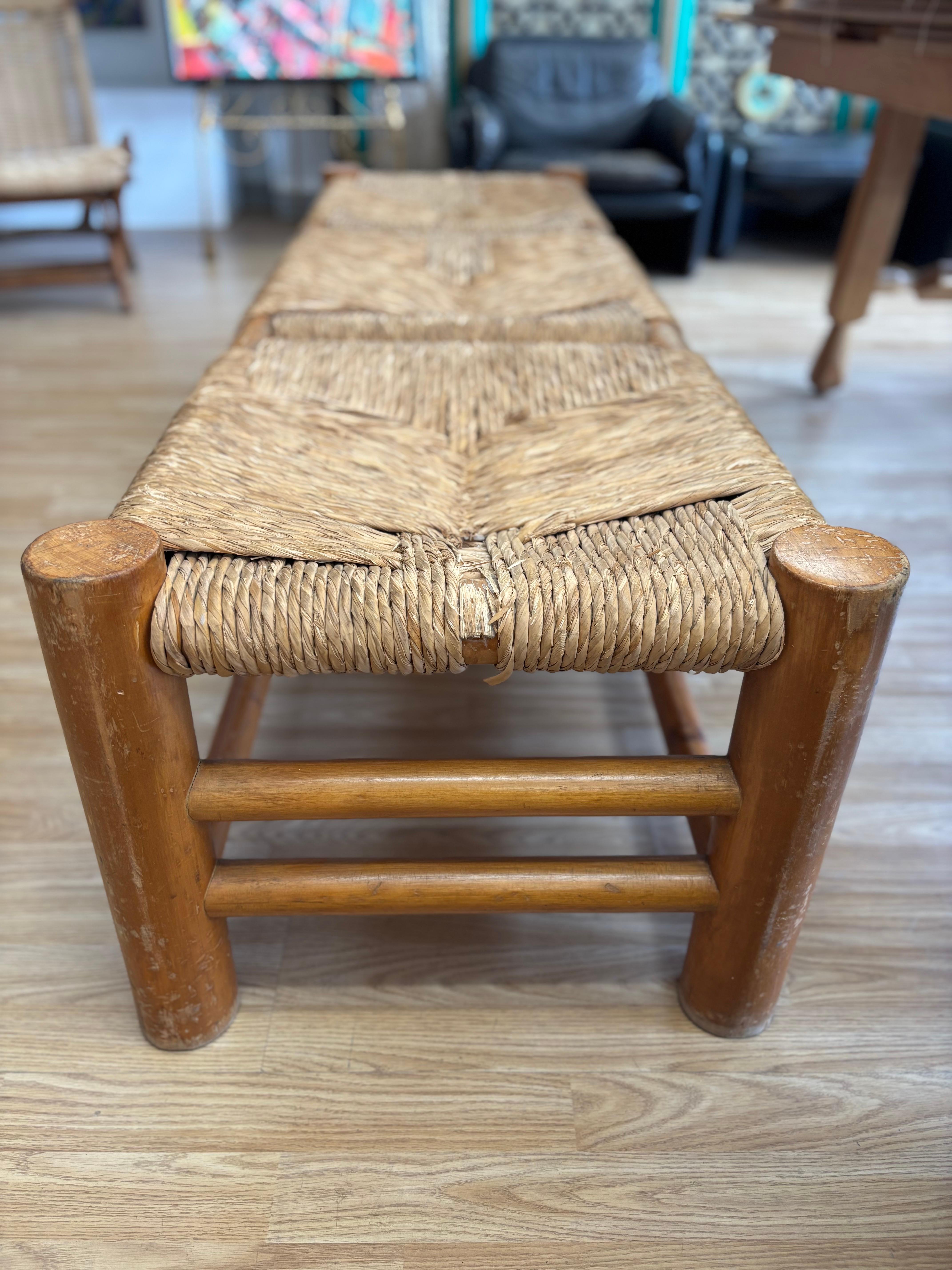Rustic Mexican bench with no back made of pine and rush. This bench has normal wear due to age and use as seen in photos.

70.5