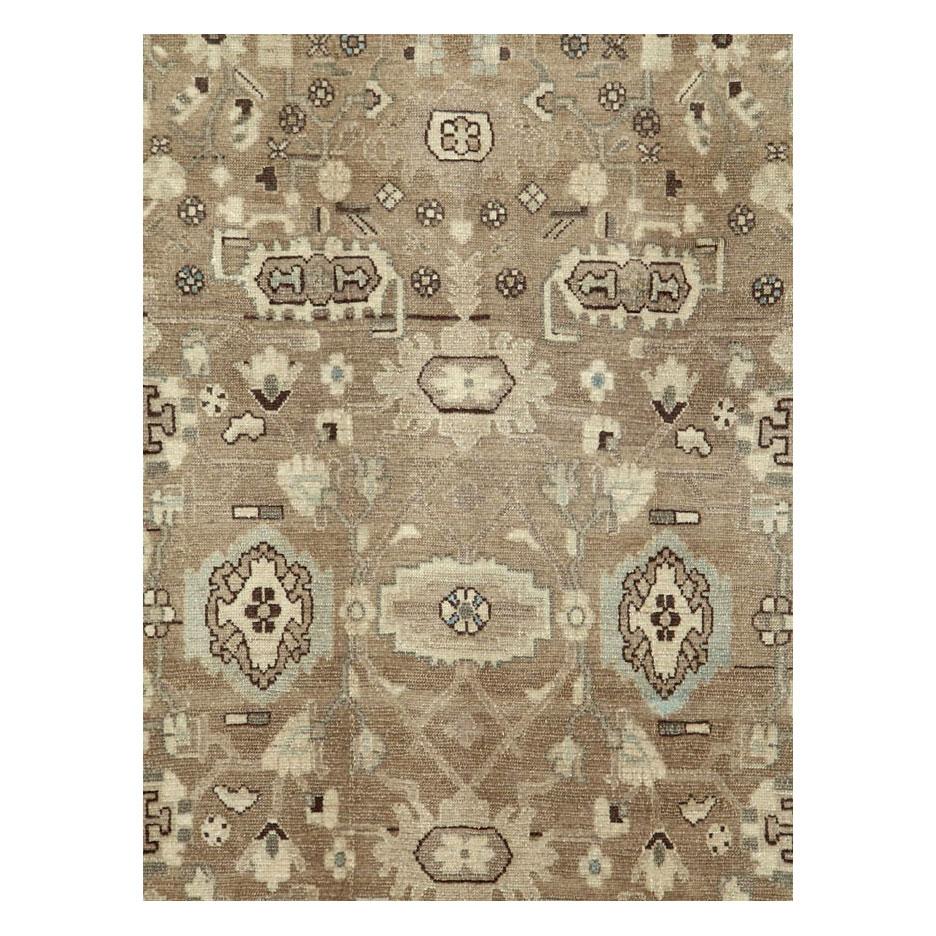 A vintage Persian Malayer accent rug in gallery format handmade during the mid-20th century with a rustic design in brown, khaki, and cream tones.

Measures: 5' 7