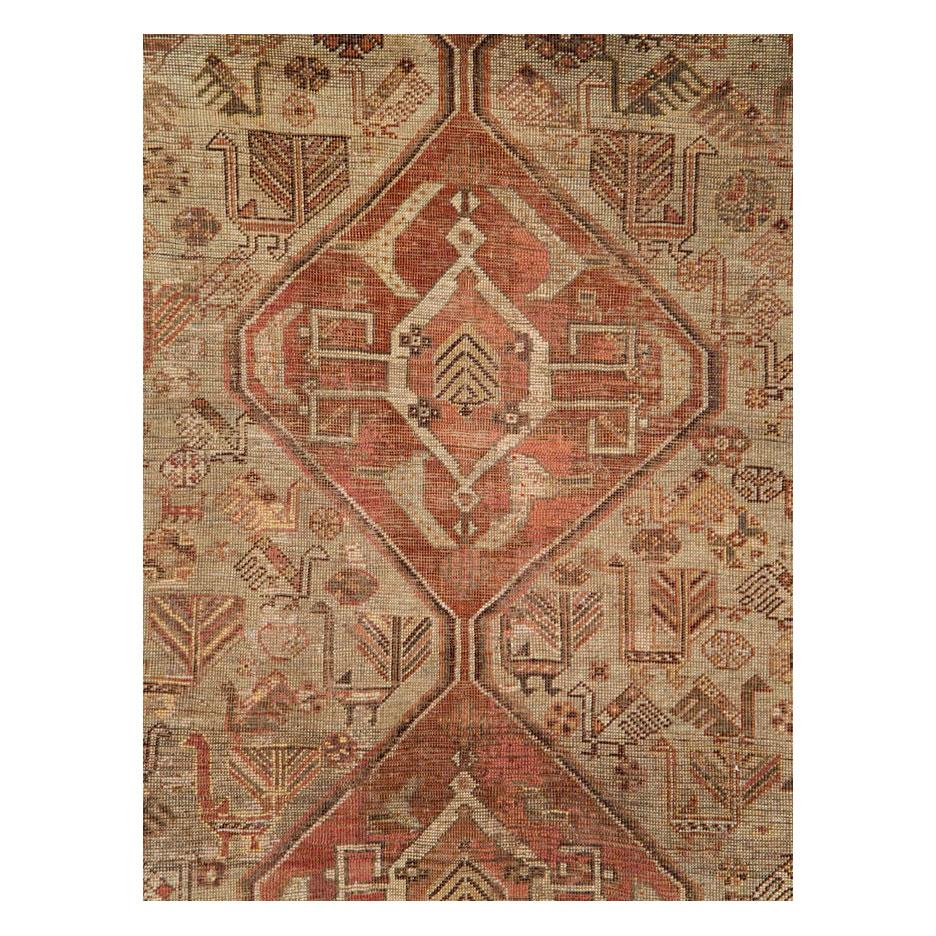 A vintage Persian Shiraz accent rug with a rustic appeal and tribal design handmade during the mid-20th century. The rug has a textured, weathered and distressed, feel but the foundation remains strong and durable.

Measures: 7' 2