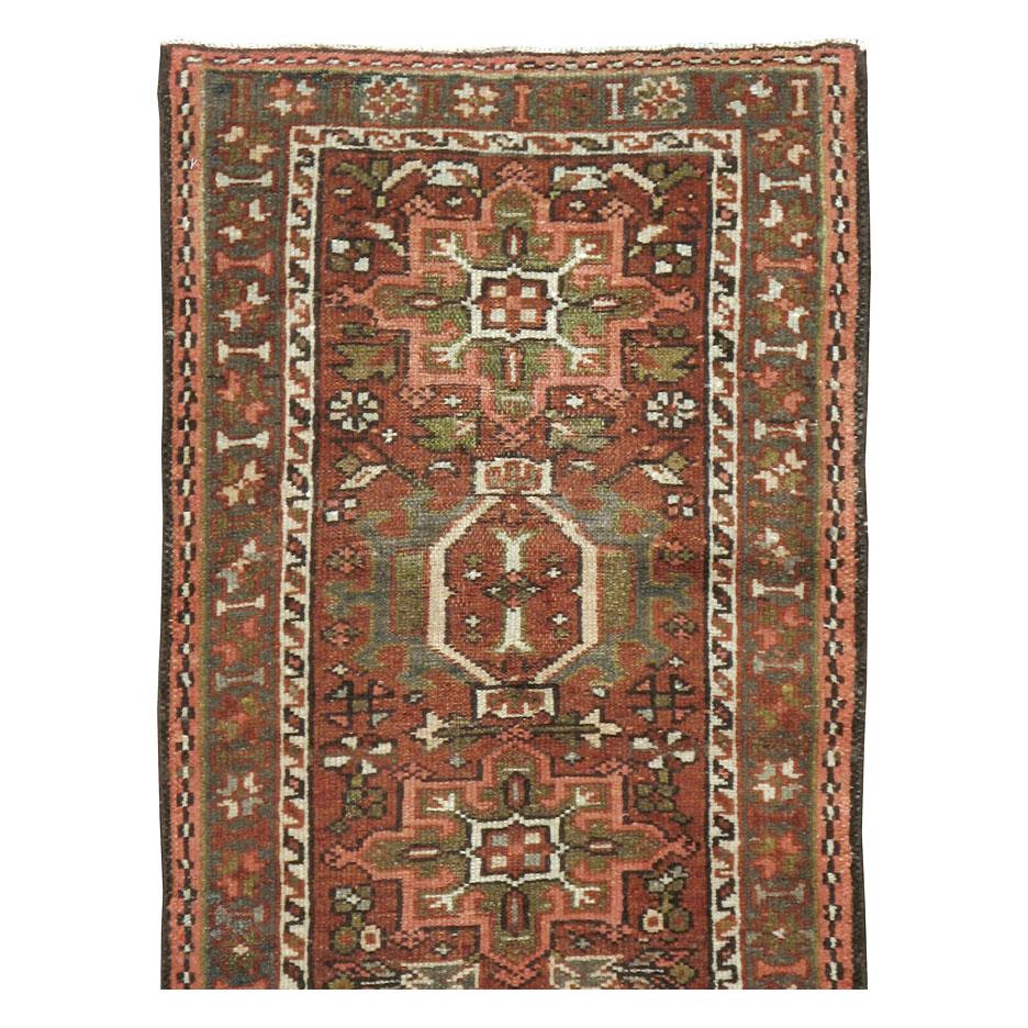 A vintage Persian Karajeh rug in small runner format with a rustic appeal handmade during the early 20th century.

Measures: 1' 11