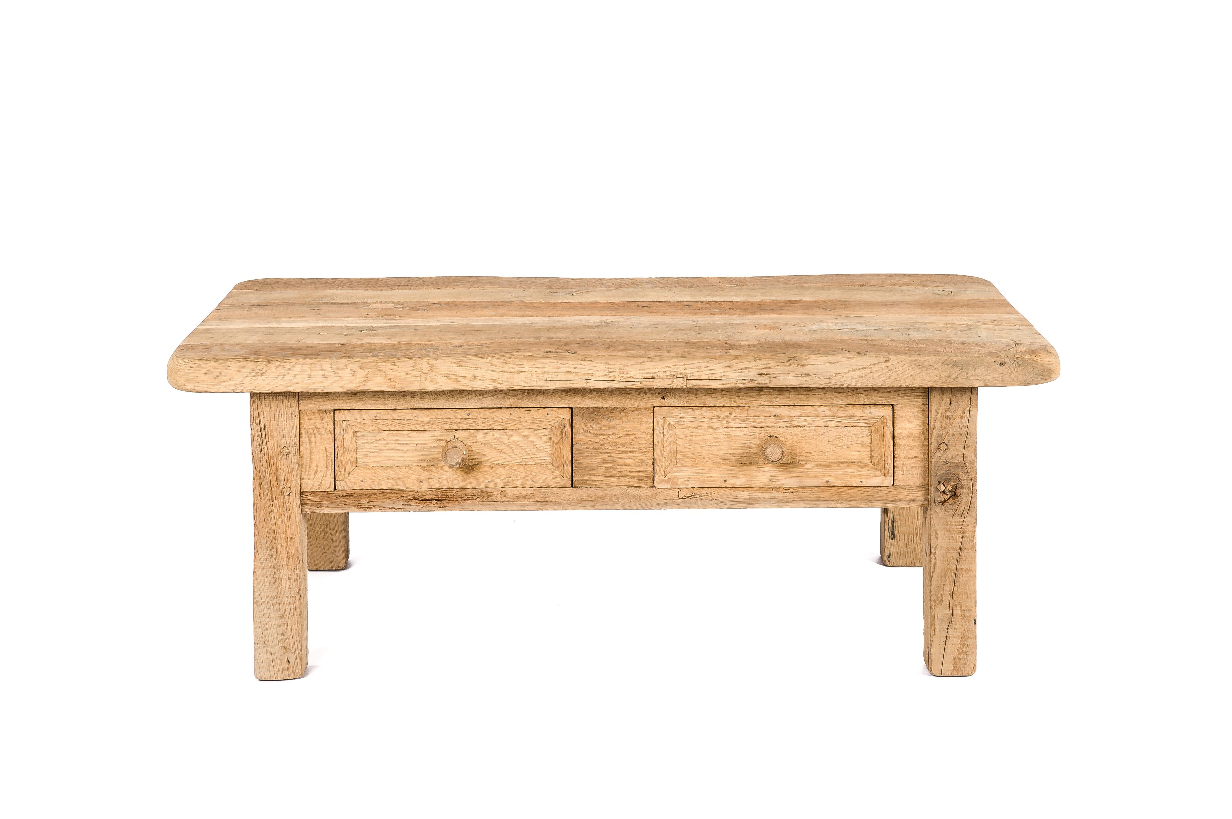 This rustic table was made in The Netherlands in the mid-20th century. It is completely made from old solid oak beams. The wood was reclaimed from centuries-old half-timbered houses in Germany. The wood was aged beautifully through many years of