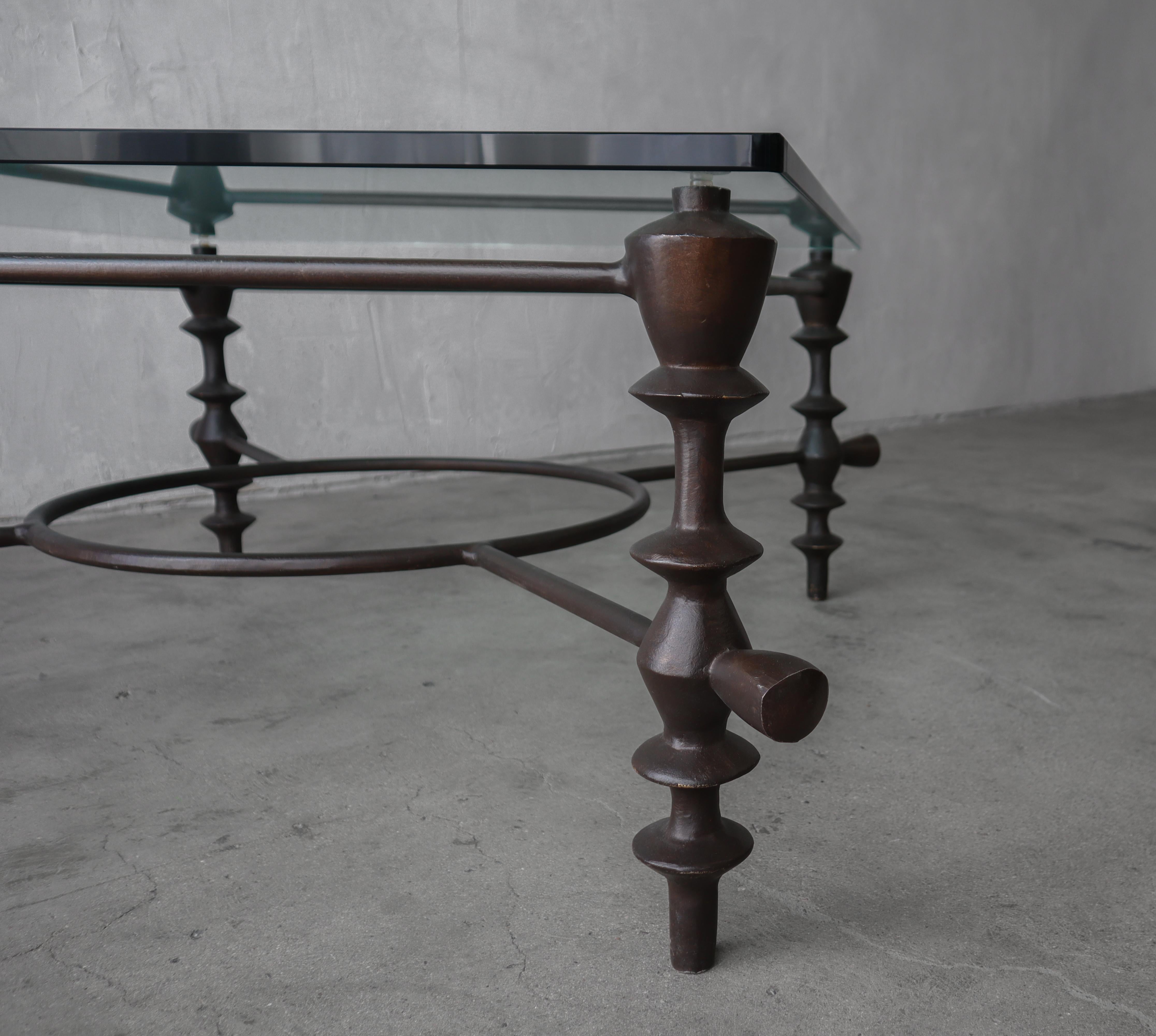 Giacometti Style Bronzed Finish and Glass Coffee Table In Good Condition For Sale In Las Vegas, NV