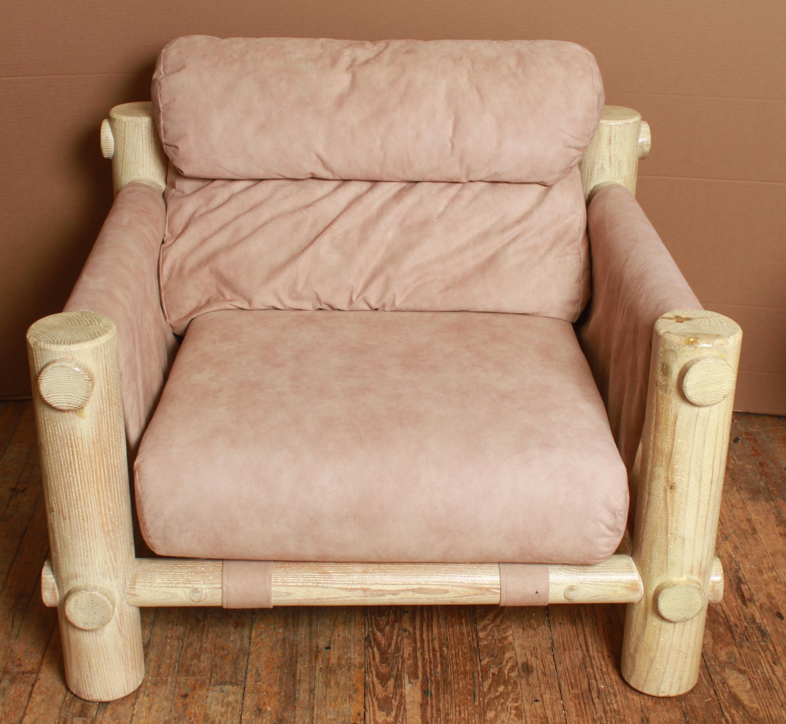 Rustic lounge chair or armchair and ottoman set with a stripped wood log frame. The set is upholstered in a beige upholstery. In great vintage condition with age-appropriate wear and use.
Measures: Chair 34