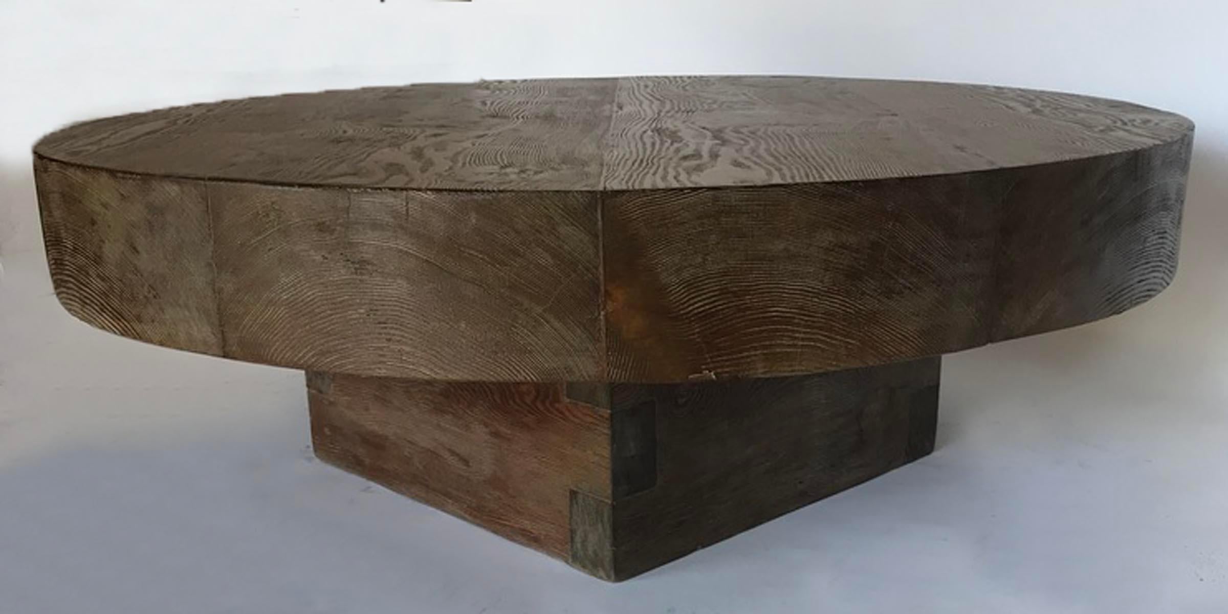 Rustic modern coffee table made in reclaimed 5 inch thick Douglas fir. Square dovetailed base. One of a kind. Finish shows knots and natural distress of the wood. Smooth finish with nice patina.
 Shown here in our 