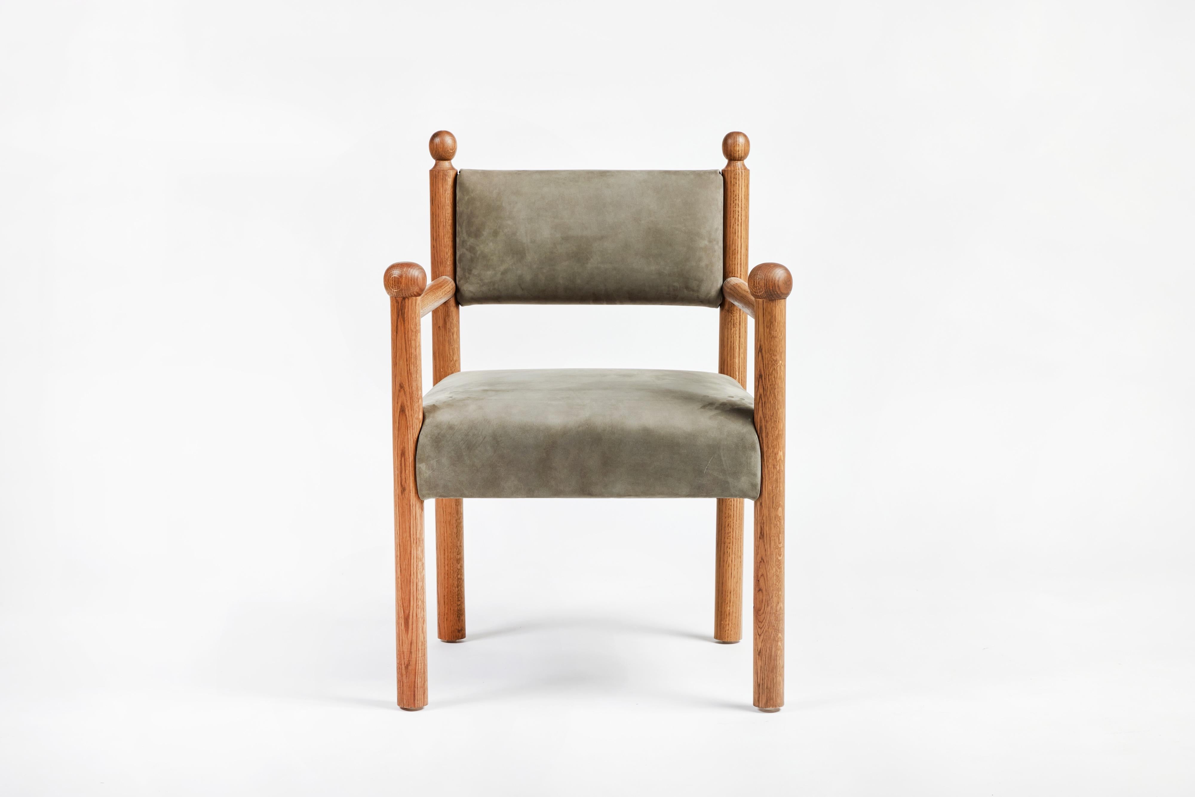 Martin & Brockett’s Sydney Dining Chair with Arms features a wood frame with finial details on the chair back and arm, as well as an upholstered seat and back.

H 33.5 in. x W 21.5 in. x D 20.5 in. Arm Height: 26”

Fabric is C.O.M. only - 2