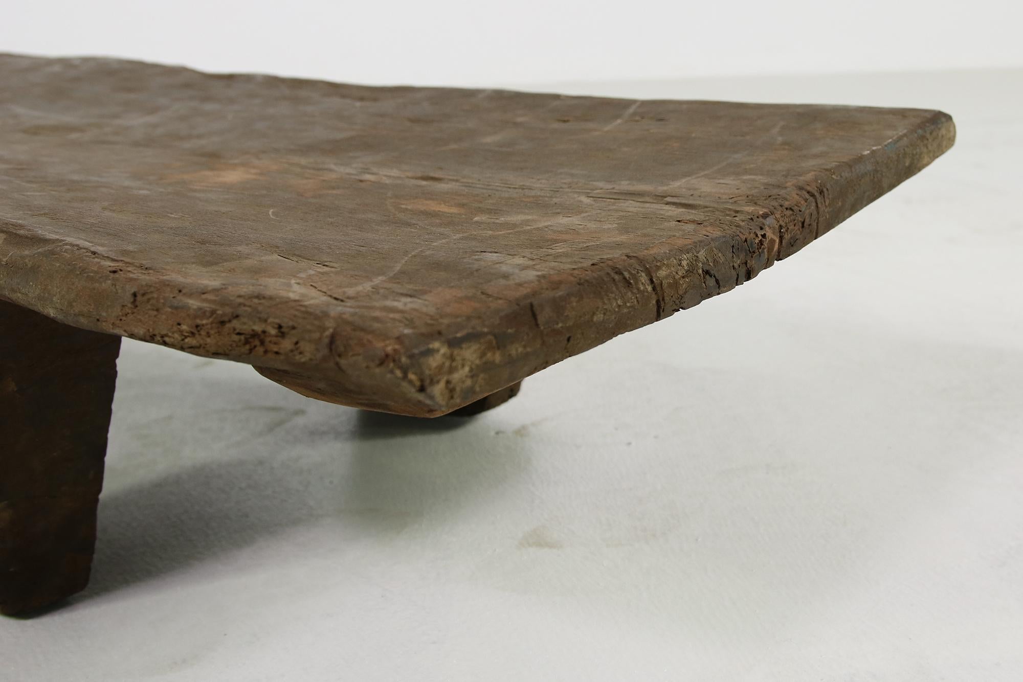 Beautiful and rare naga table, made of one piece of solid, hard, ancient wood. Completely hand carved, beautiful unique piece, super sturdy, possible to put everything on it, using it as a daybed or bench. Legs are not removable, as it's carved of