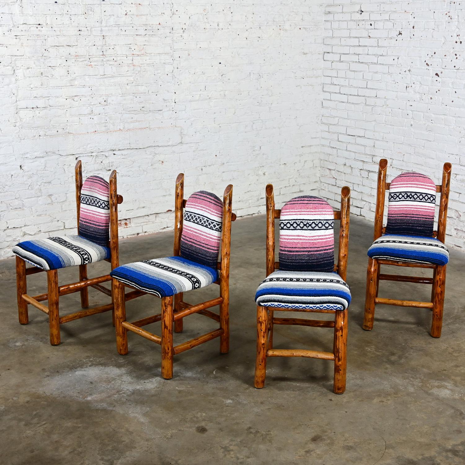 Handsome vintage Rustic natural log frame dining chairs with traditional serape or jorango blanket upholstered seats & backs. Beautiful condition, keeping in mind these are vintage and not new so will have signs of use and wear even if it has been