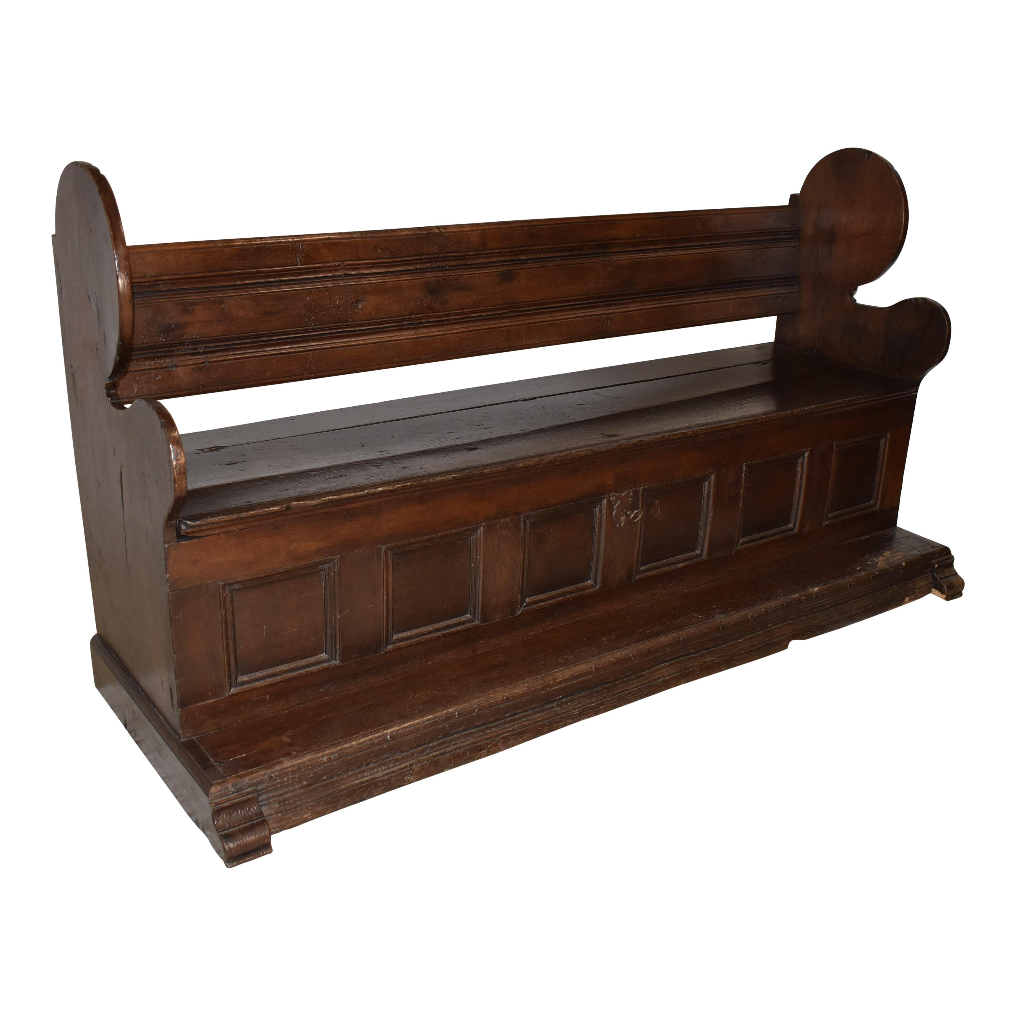 Seating and storage abound in this rustic bench from Belgium. Crafted in the late-19th century from roughly hewn oak, it has all the look of age-worn stability and rugged reliability. With a wide backrest that is supported by shaped side wings, the