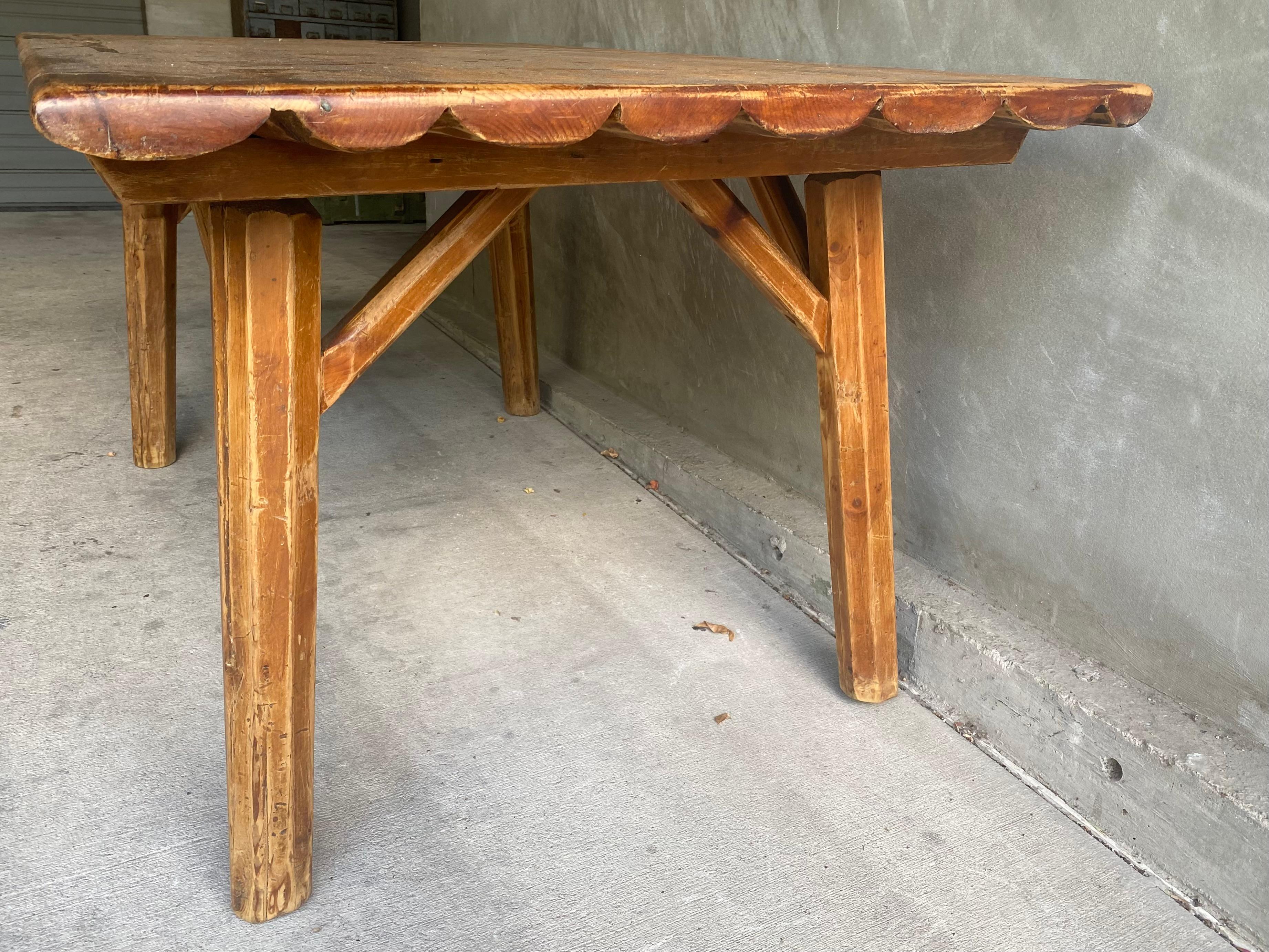 Dining table, hand hewn from solid oak with wax finish.