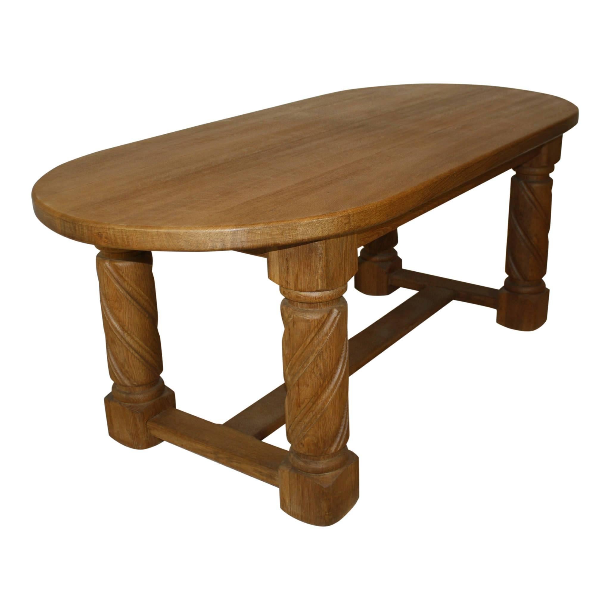 With a top generously crafted from two inch, quarter sawn oak, this table boasts of quality and stability. Large, spiral-fluted legs give solid support to the substantial top. The legs are united by stretchers.
 