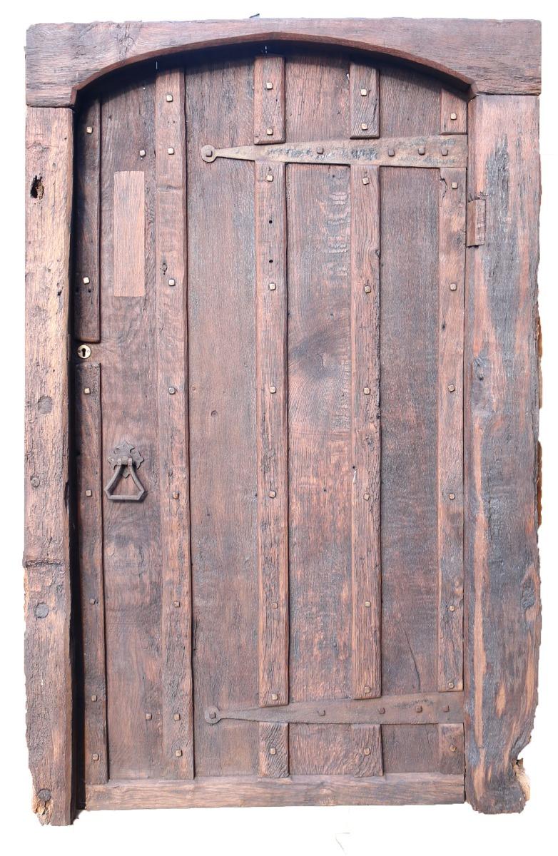 A reclaimed English Georgian period farmhouse door, complete with frame. Salvaged from a house near Egham.

Additional Dimensions:

Height 186.5 cm overall

Width  120 cm

Depth 16 cm

Frame Opening Height 181.5 cm

Frame Width 94