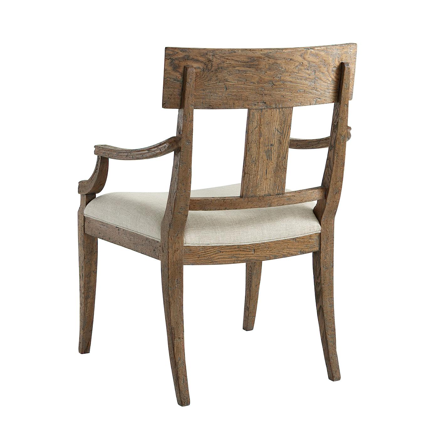 A rustic oak Klismos dining chair in our light Echo finish, with a parquetry bar top rail and splat, upholstered saddle seat raised on square tapered legs.

Dimensions: 23.75