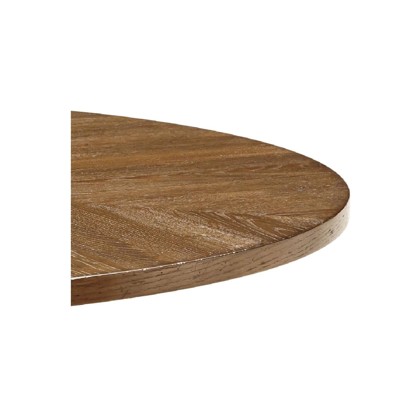 Une table à manger ronde en chêne rustique avec des pieds effilés. Cette belle table est dotée d'un plateau radial en parquet de chêne et repose sur un piédestal en forme de cage conique.

Montré en finition aube
DIMENSIONS
48