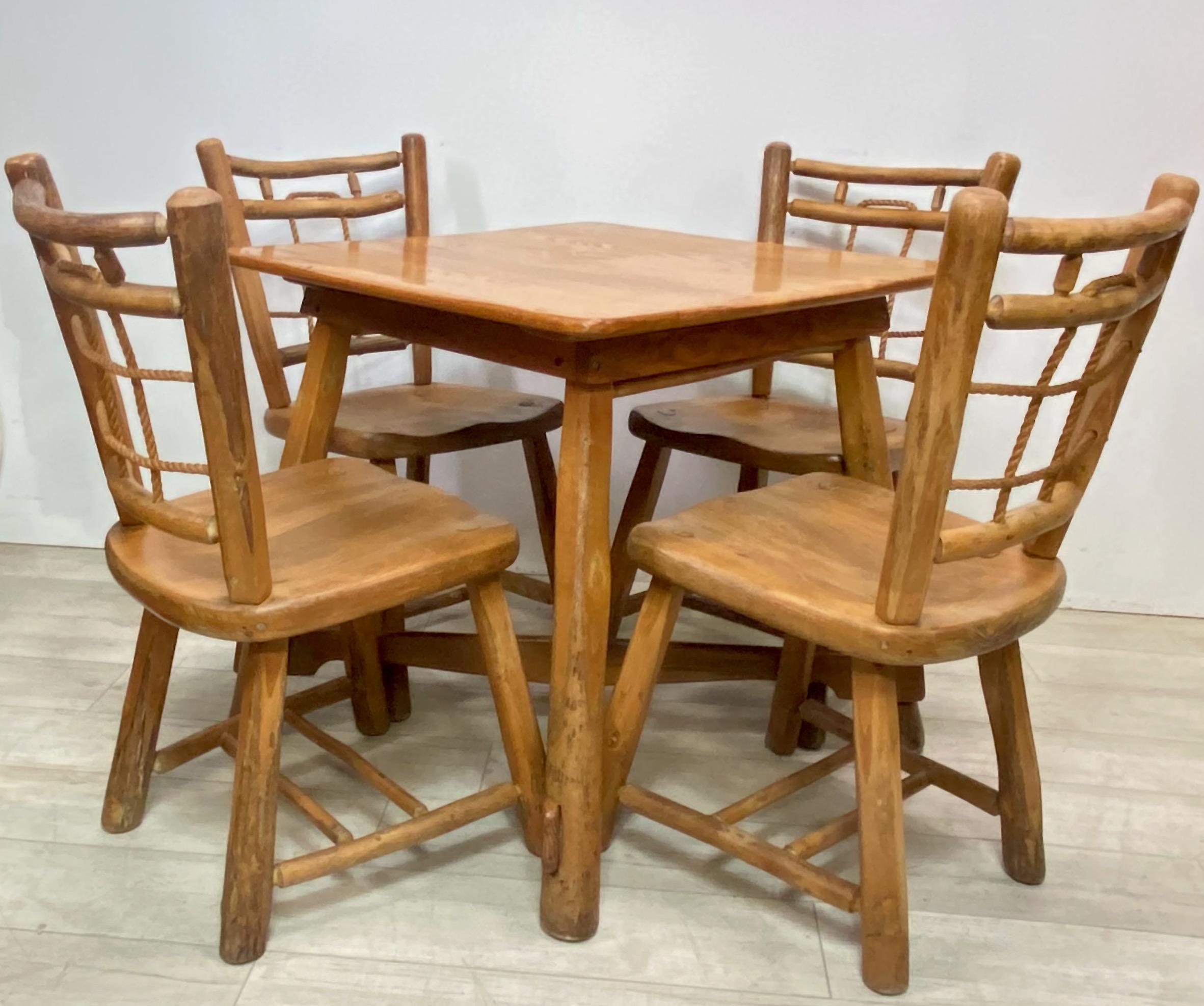 A rustic dinette set, consisting of a table and four matching side chairs with unusual and unique woven rope back detail.
Original branding maker mark of Old Hickory Martinsville IN.
American circa 1950
Overall in wonderful original vintage