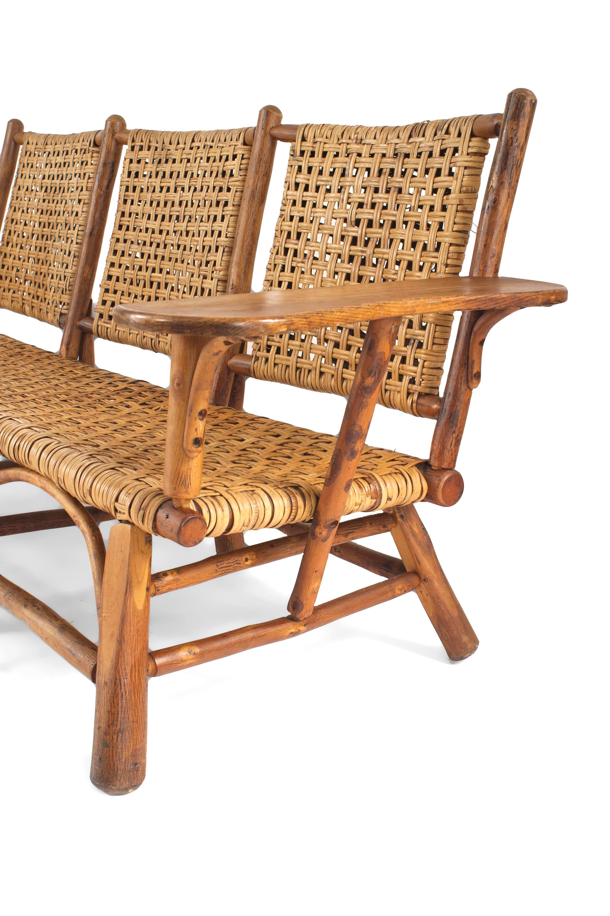 Rustic Old Hickory settee with woven seat and back oak plank armrests. See matching armchairs; dealer reference number 061005B.


Since 1899 Old Hickory Furniture has been handcrafted in Central Indiana using the remarkable hickory sapling and other