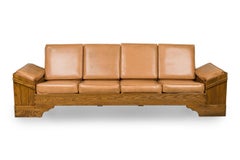 Sillón rústico de madera de nogal americano y cuero tostado