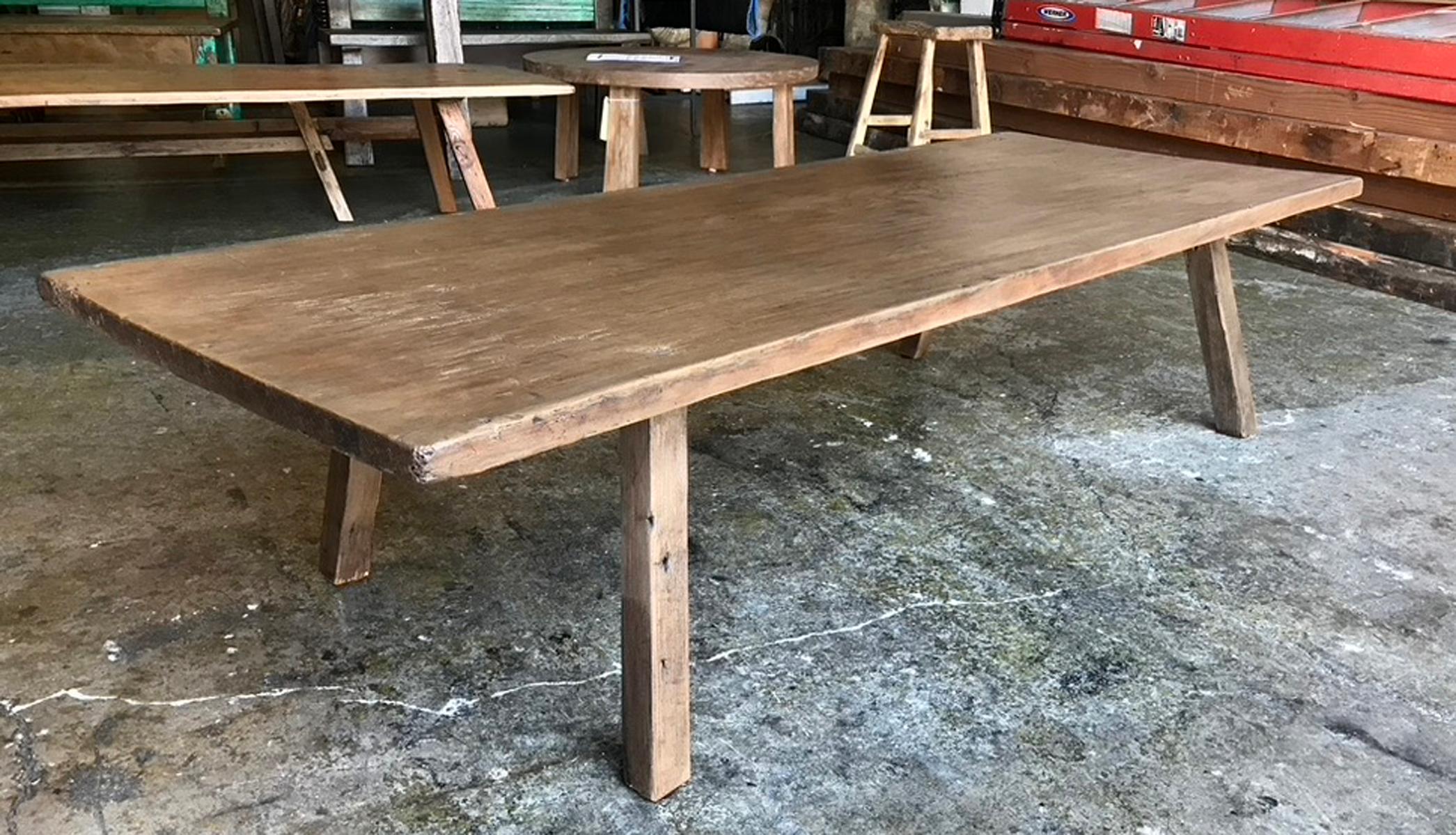 Rustic coffee table consisting of an antique one wide board from Guatemala, atop contemporary legs, finished to match the top. The top shows age appropriate wear, please see close up photos. Construction is new and sturdy