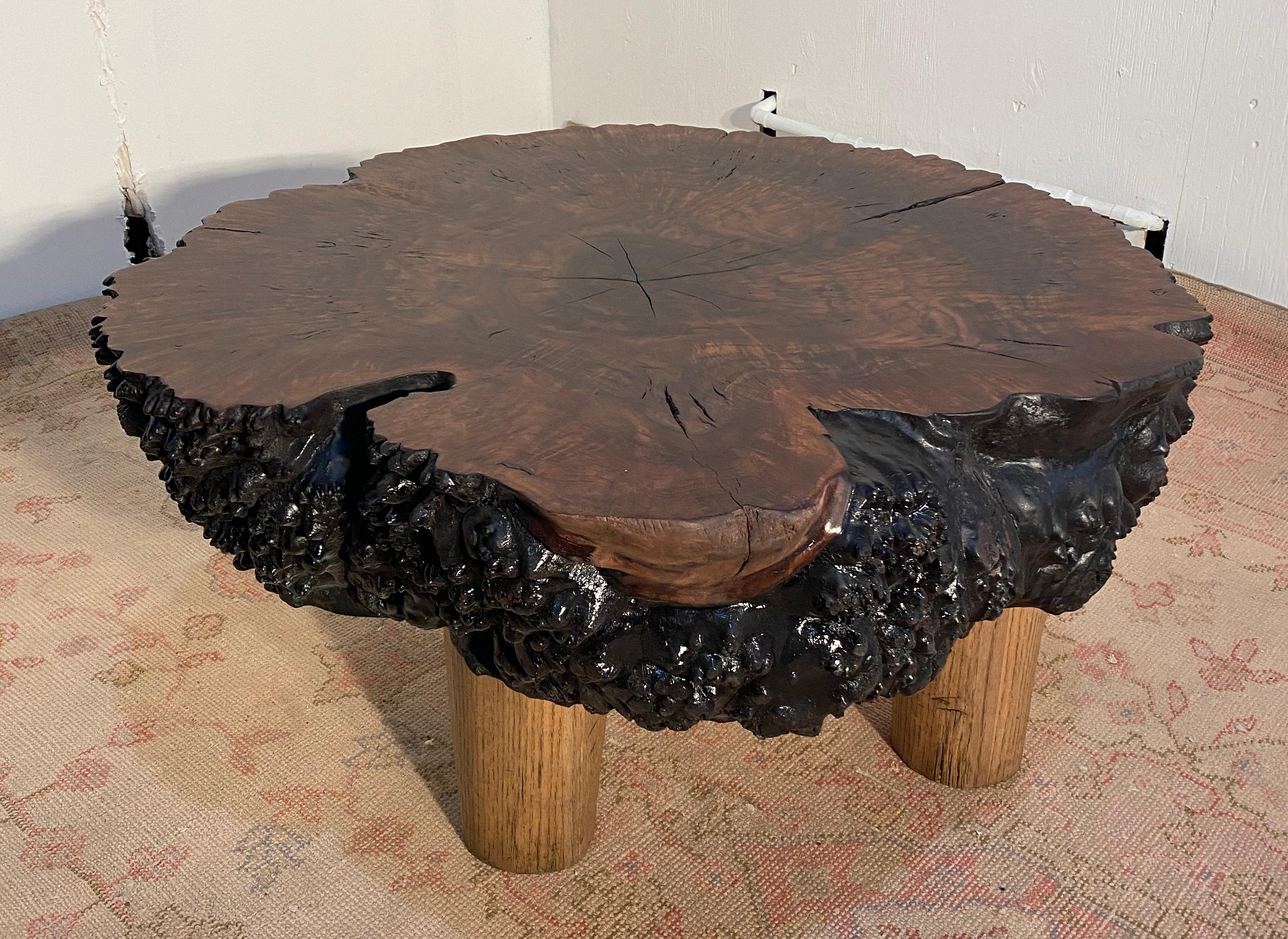 These one of a kind indiginous rugged primeval burl tables are of veritable vitality due to their
naturalistic form. We retained the bark sub-strata which gives the table it's rough texture. The
shell has been finished with a special lacquer over