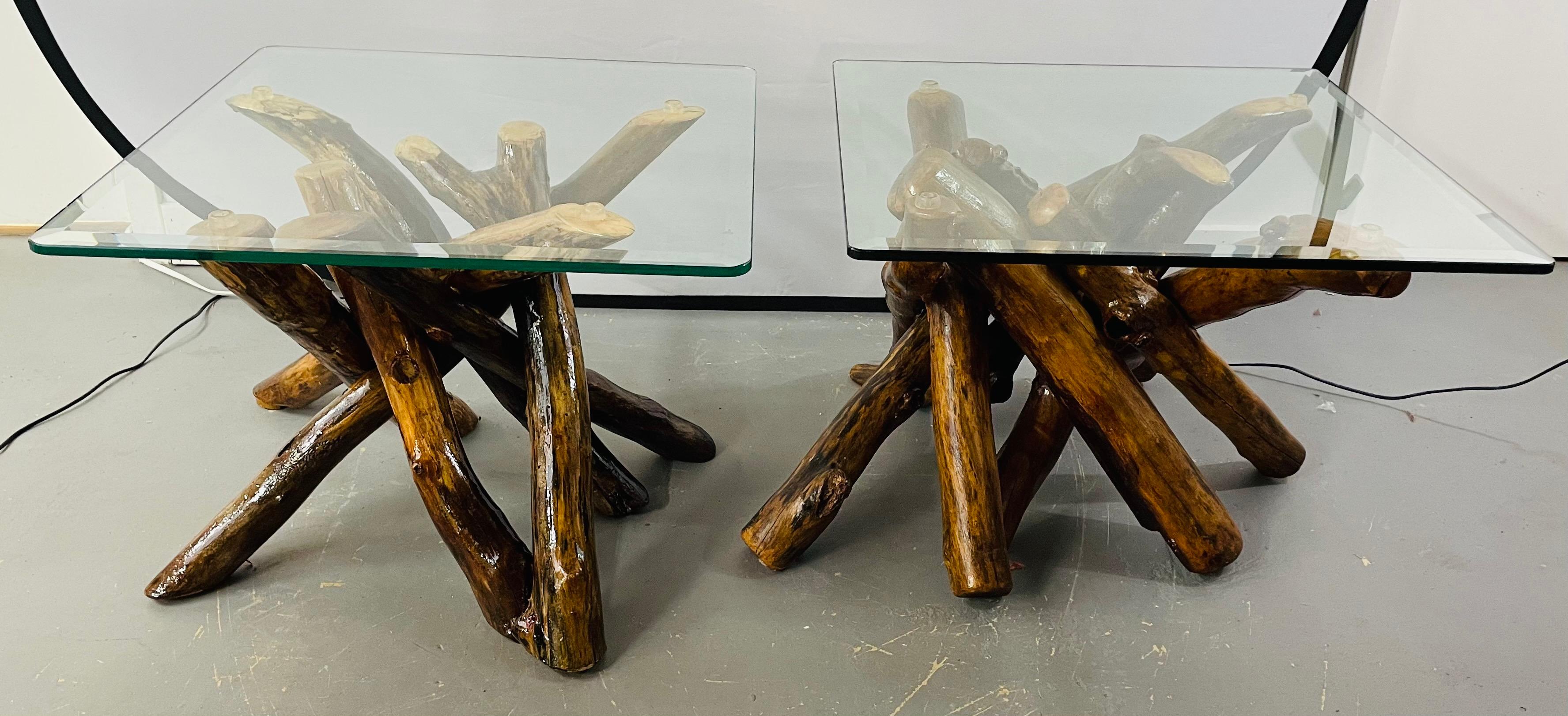 Side tables of reclaimed wood and bevelled glass top, a pair

A pair of rustic natural wood base side or end tables in an organic design fashion. This amazing pair of end or side tables feature veneered maple wood twist logs put together in an