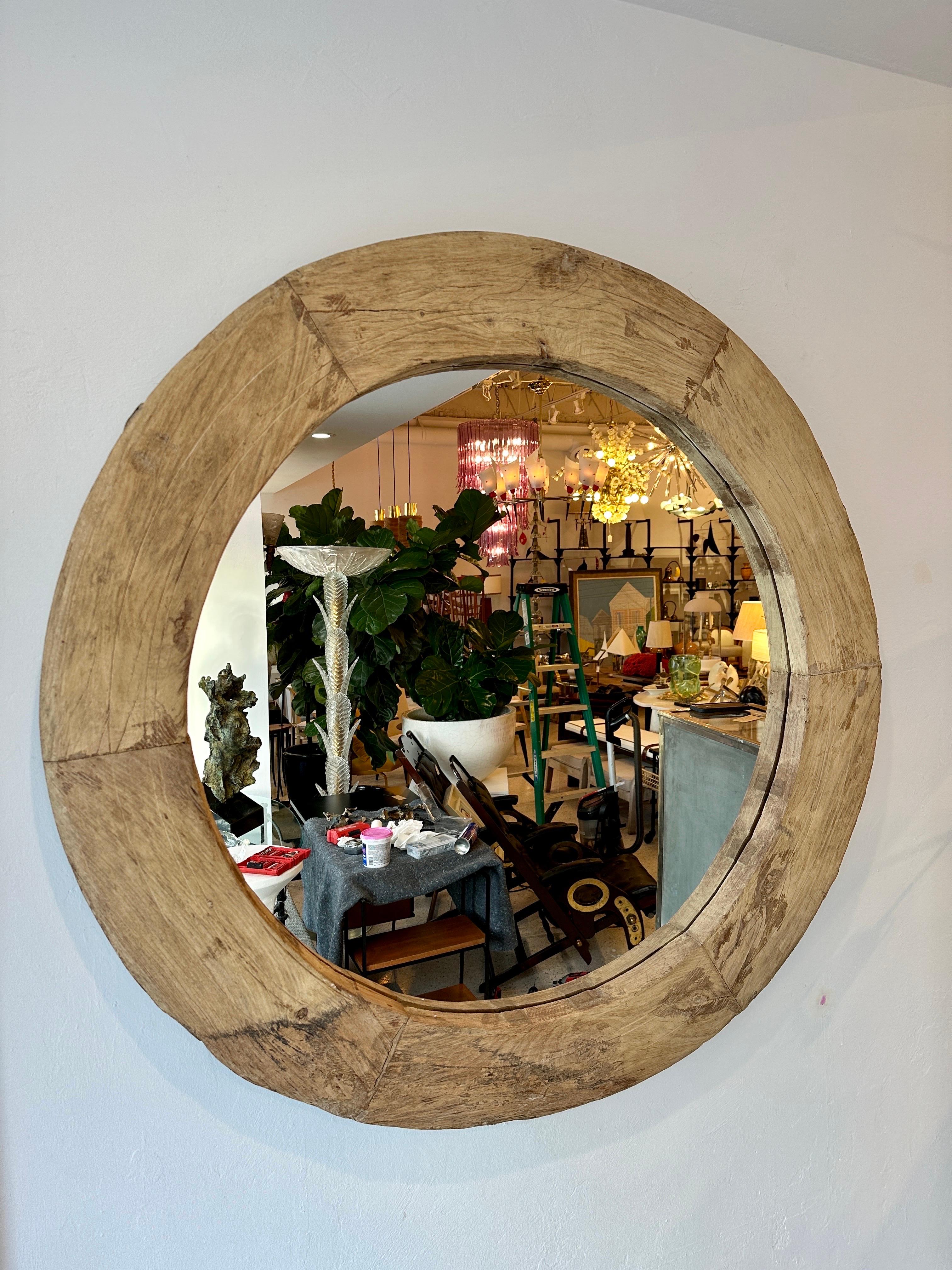 This VERY large round naturally rustic wood framed mirror is such an organically perfect option for your decor.  THIS ITEM IS LOCATED AND WILL SHIP FROM OUR MIAMI, FLORIDA SHOWROOM.