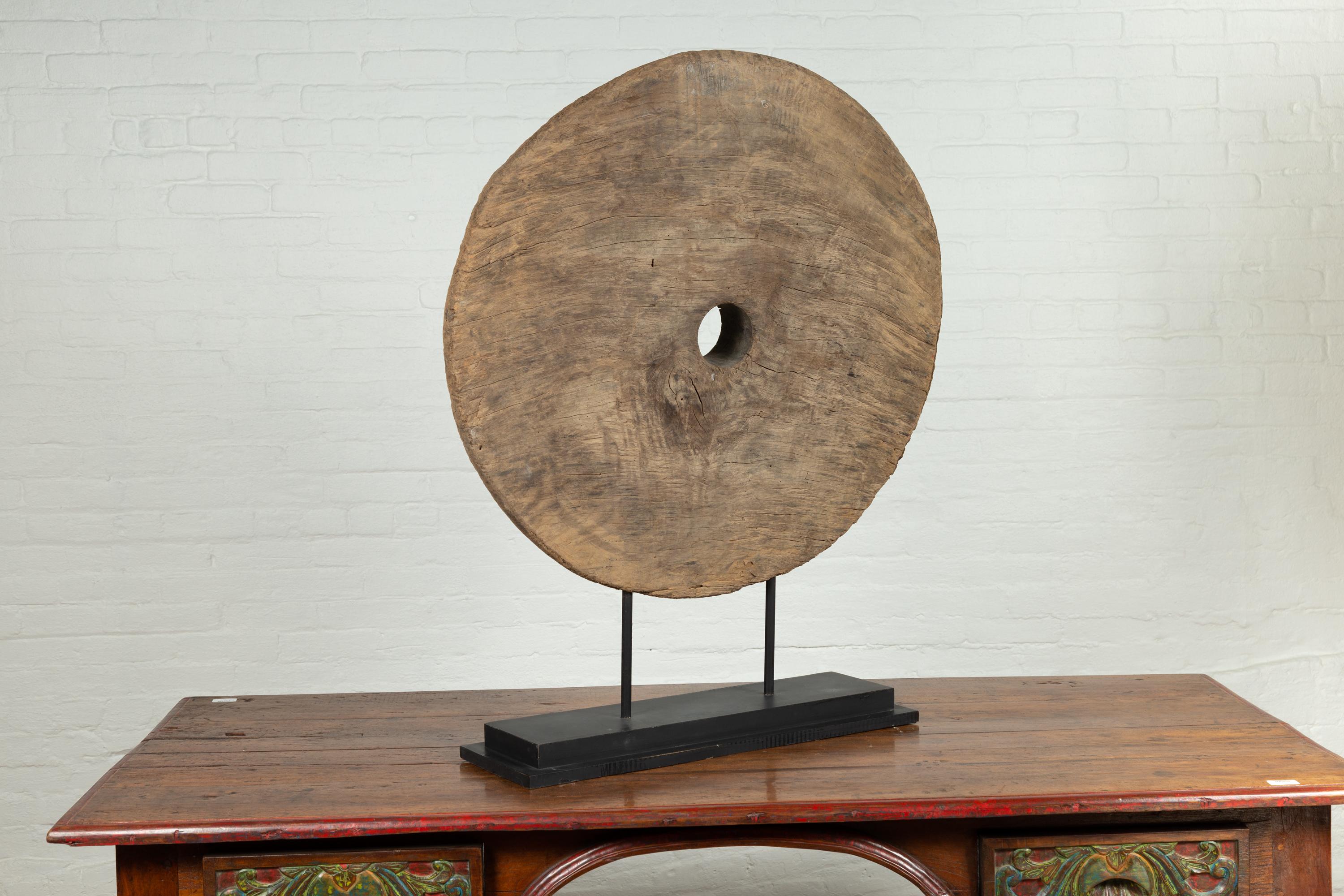 19th Century Rustic Ox Cart Wooden Wheel from Thailand, Mounted on Black Painted Base For Sale