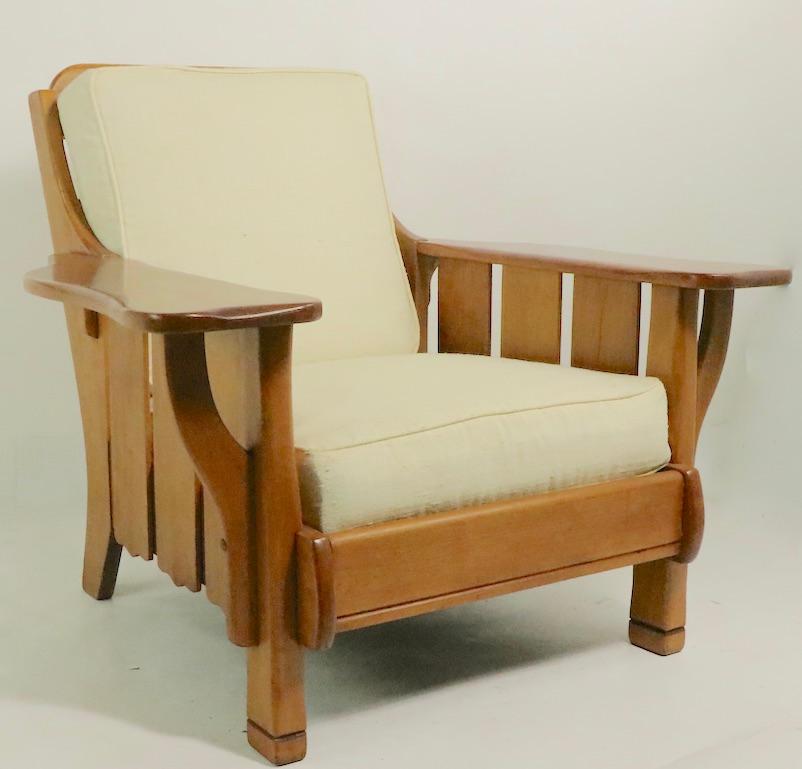 Comfy and welcoming lounge chair having a solid maple frame and inner spring cushion seat and backrest cushions This stylish rustic chair is attributed to Cushman, however it is unsigned. Very fine condition, clean and ready to use.
Measures: Total