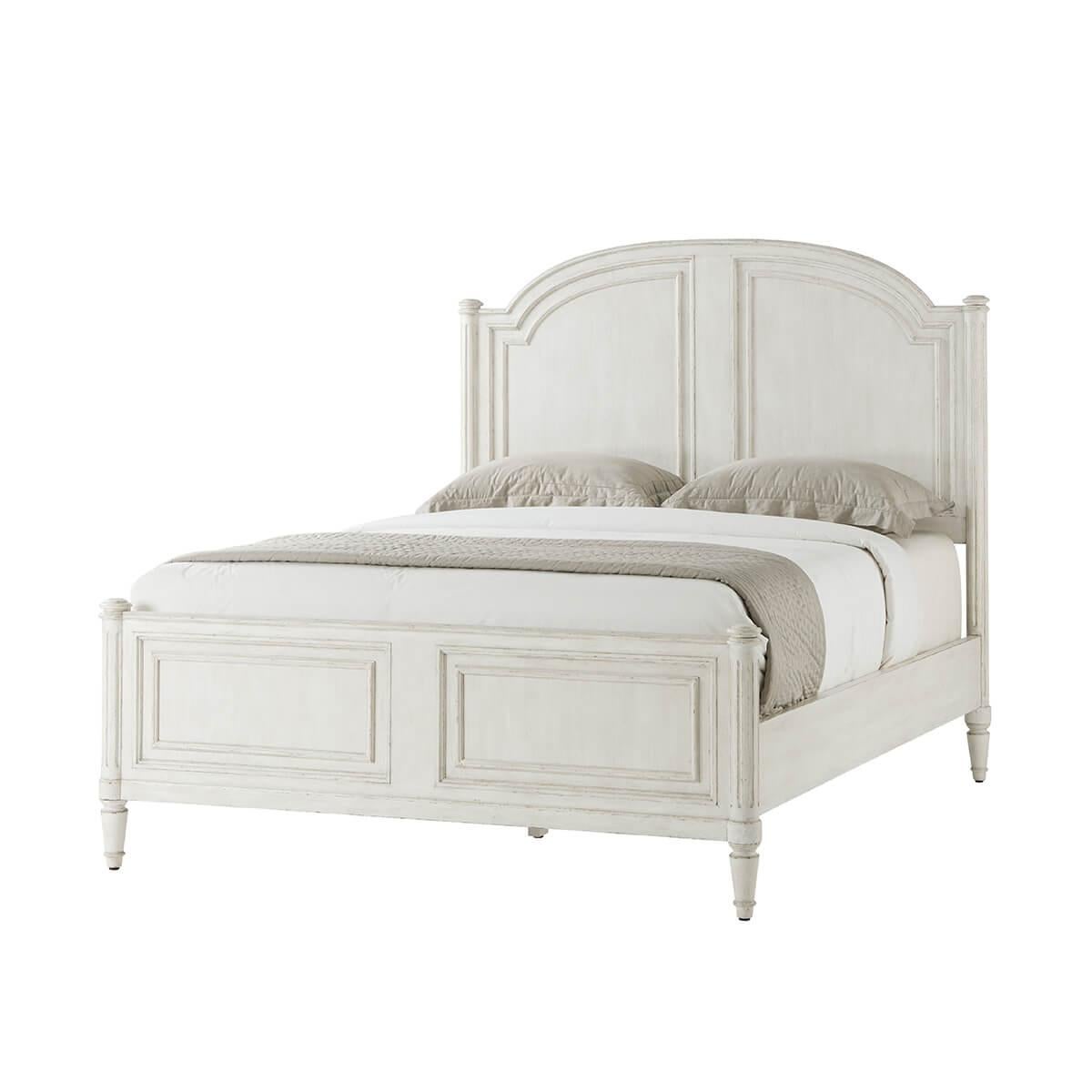 A white washed painted four post queen size bed with carved arch panel headboard and paneled footboard with turned posts having ball finials and raised on fluted styles and turned and tapered feet.

Dimensions: 65.75