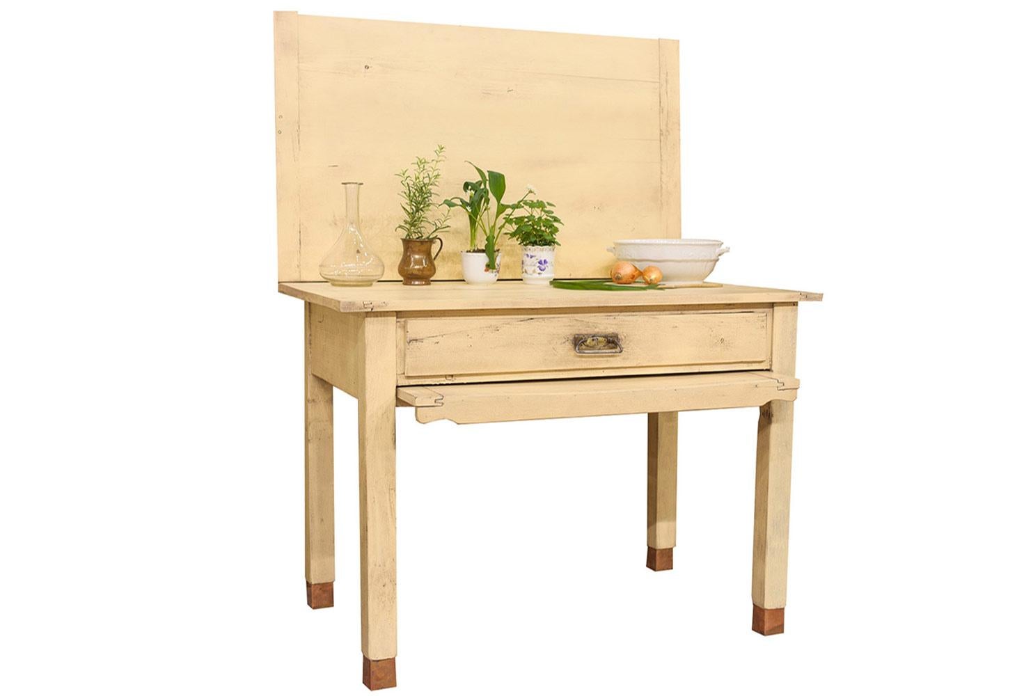 Rustic painted pine table. A versatile kitchen table featuring a top which pivots through 90 degrees to reveal a storage box beneath then unfolds to double its surface area. Could also be used as a kitchen island or a dining table. In strong sturdy