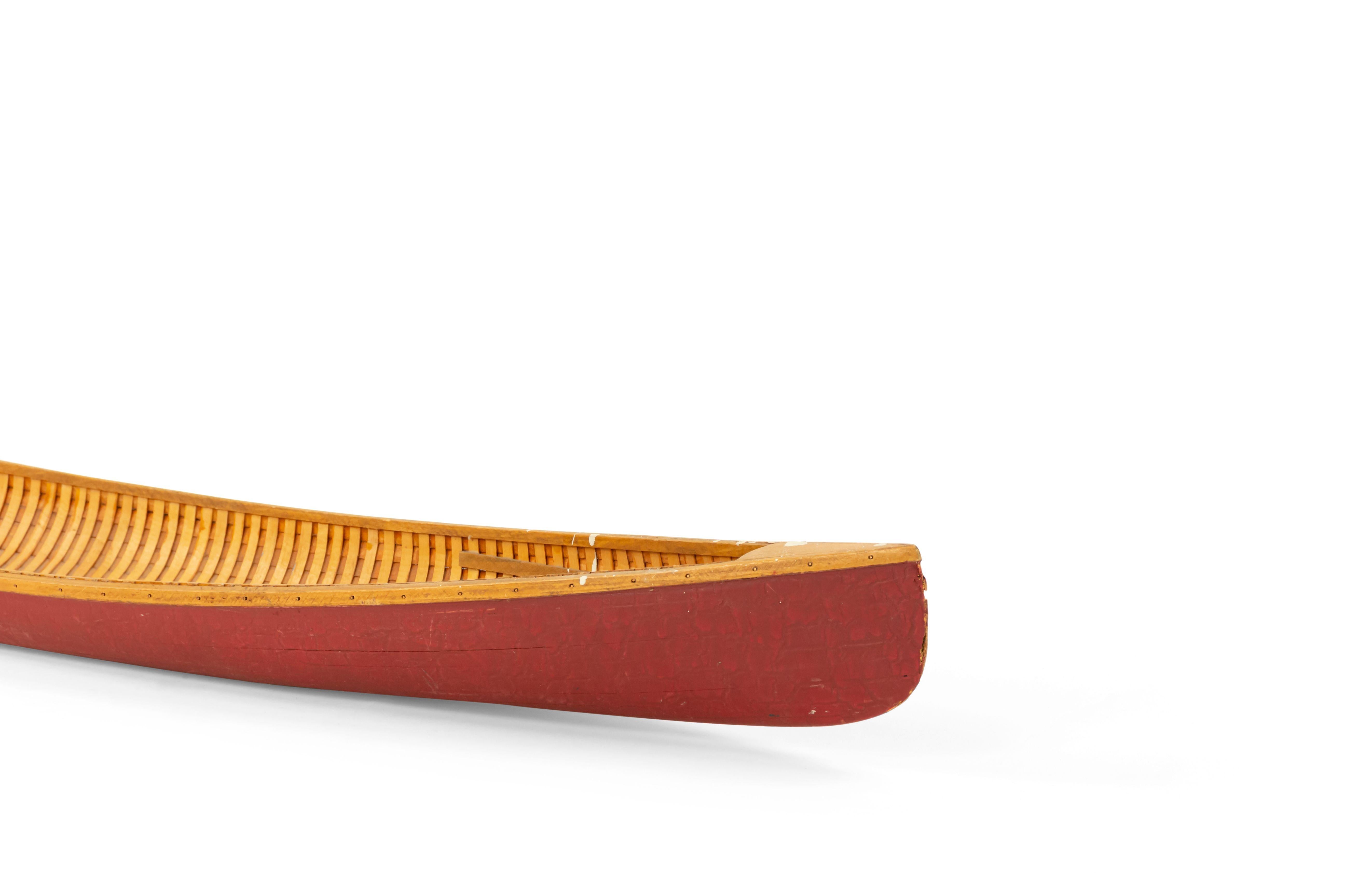 American Country Rustic style mid-century large red painted model of a canoe with a ribbed interior.
 