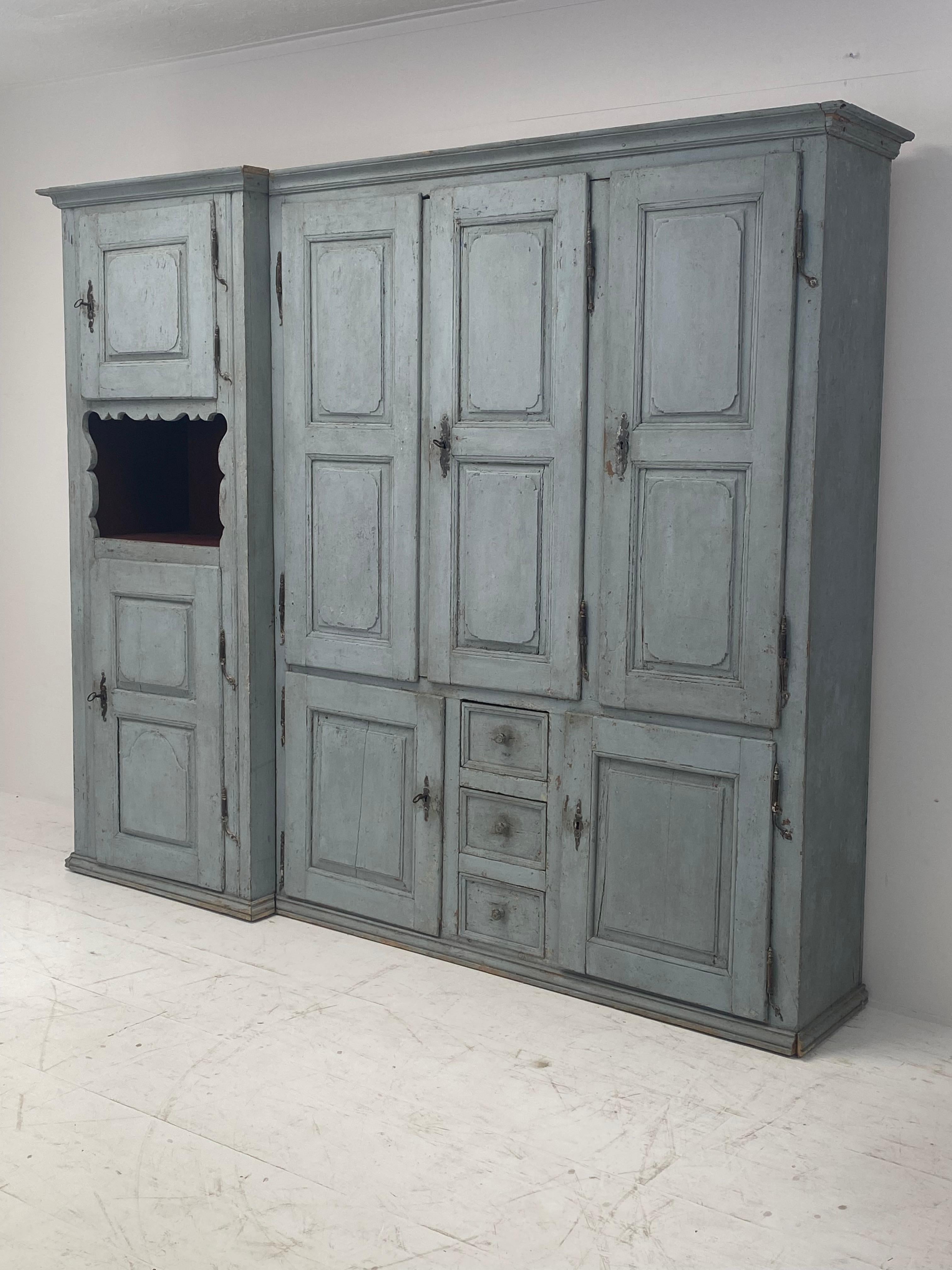 Exceptional, rustic French Cupboard in a original patinated Wood,
from the Eastern part of France,has its Italian Influence,
from around 1780,
extremely beautiful original Blue/Grey Color and Patina,combined with a warm Red color the